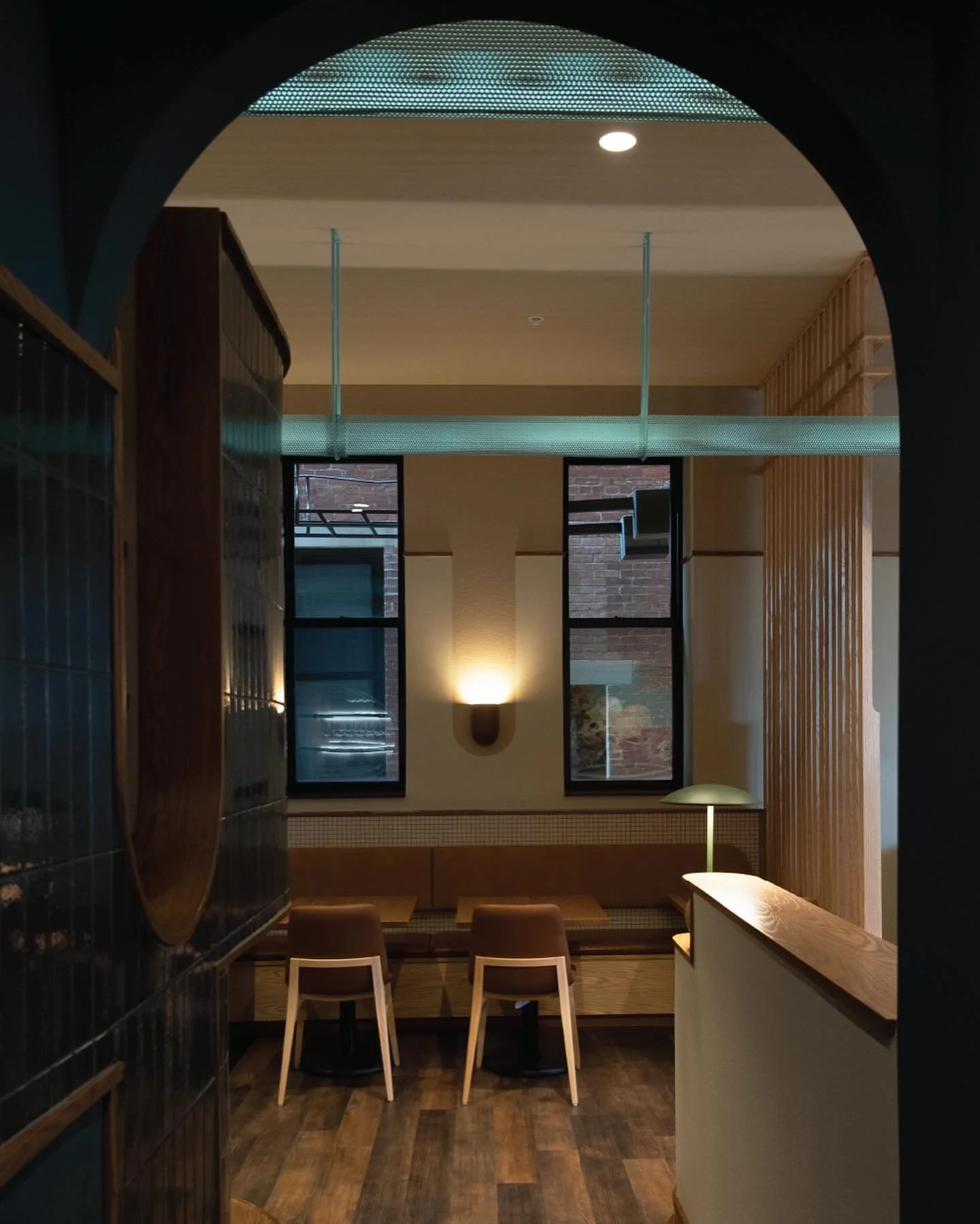 Wildweed, Cincinnati, OH

An amorphous tile-clad wine cooler, drink well, and point of sale hearkens the entrance to a disconcertingly spiritual utility hallway. A basilical barrel vault terminates into an apse and seasonal votive niche by the dishwa