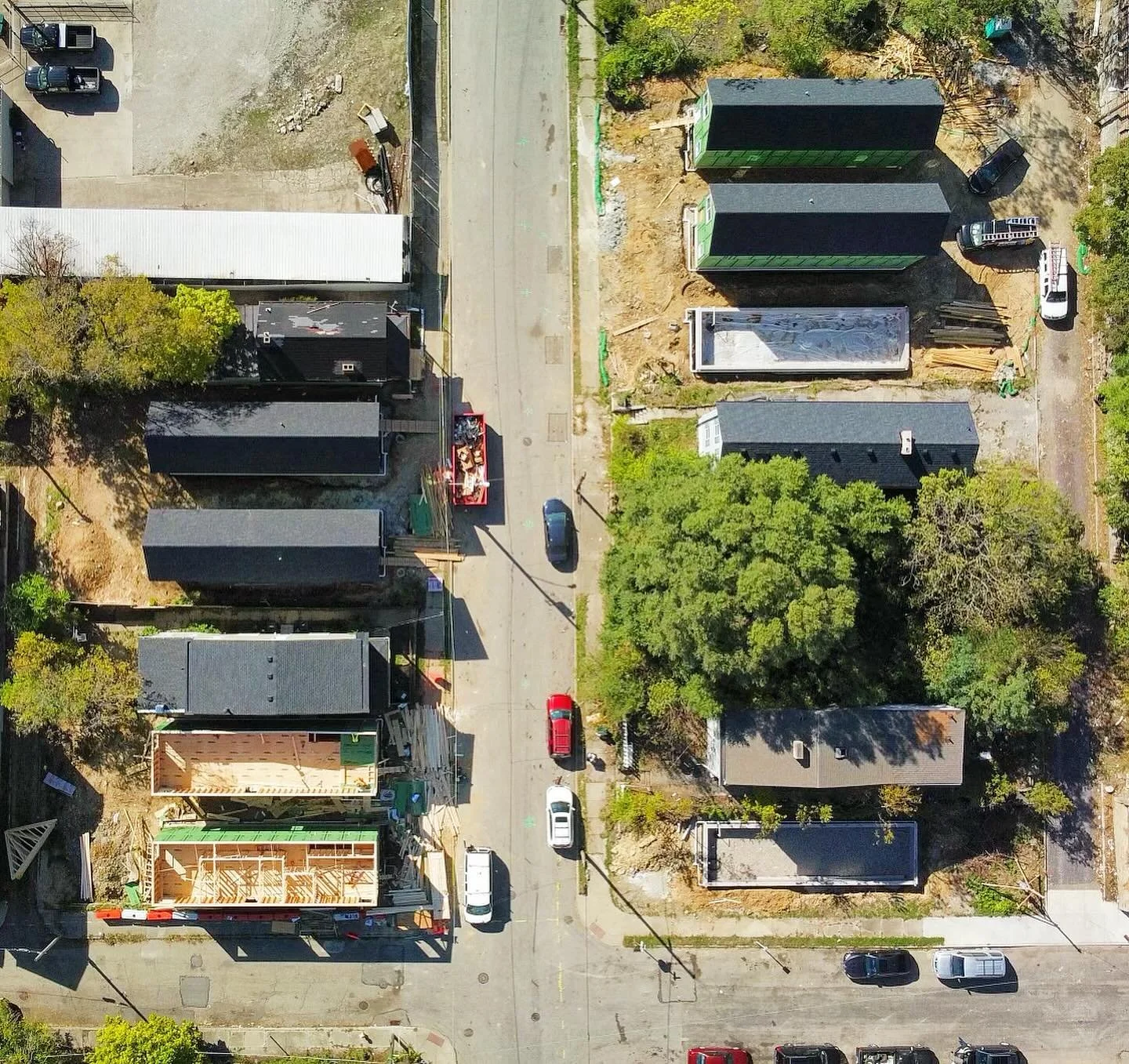 A couple of aerial views of our 8 single family homes with @cincinnati_port as part of the first phase of their ARPA funded affordable housing new construction in Walnut Hills. 

The second photo shows 7 of the 8 in context with the neighboring struc
