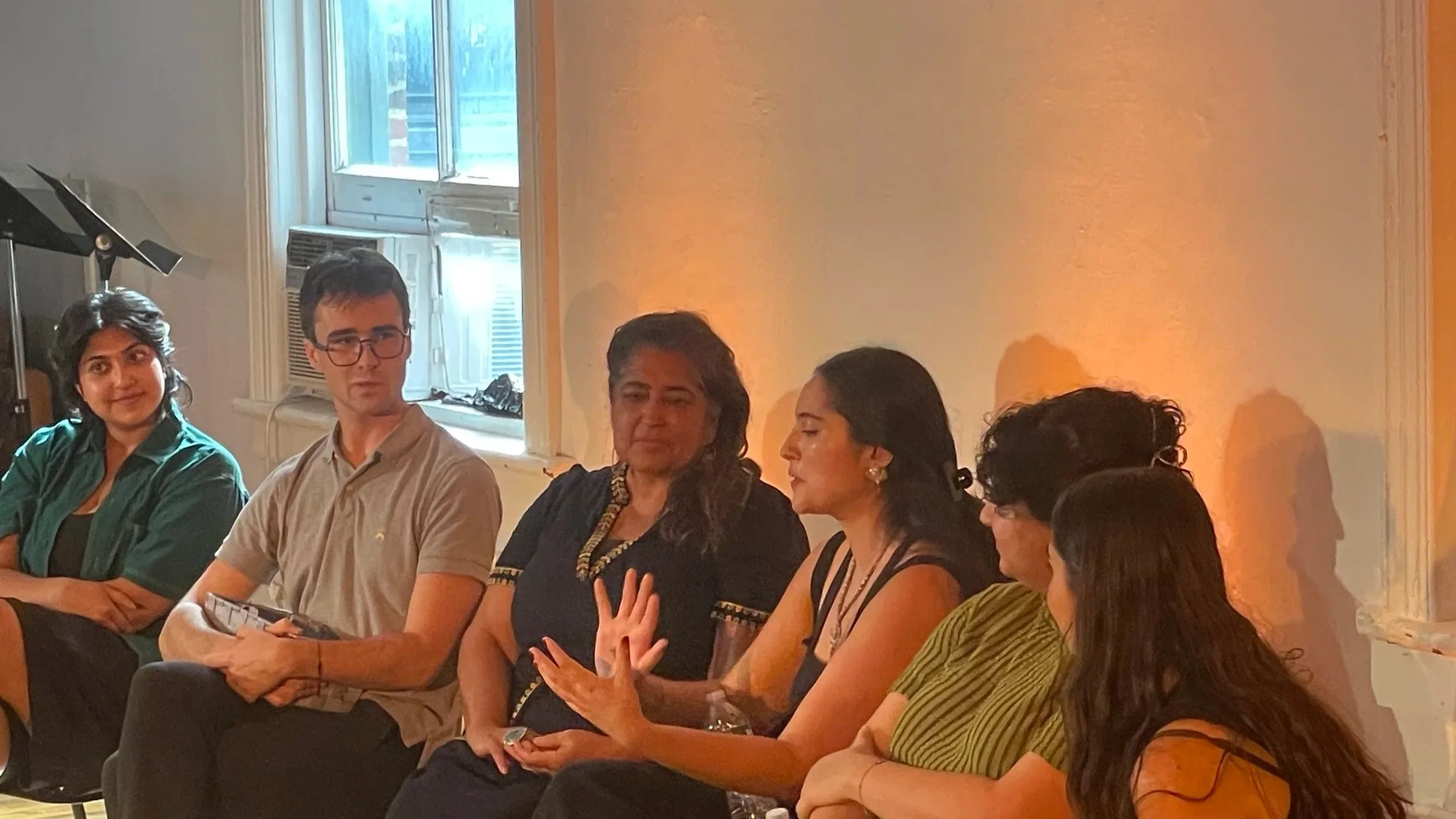 Six people seated at a panel discussion 