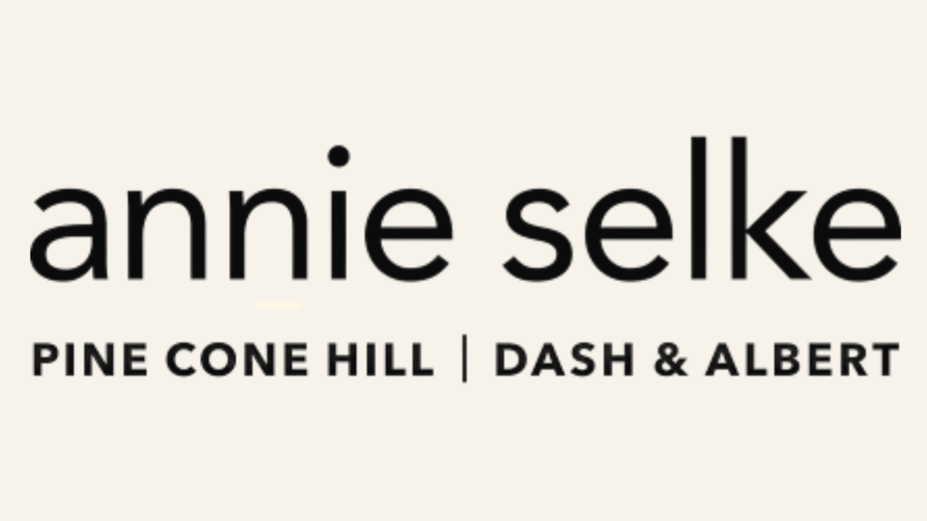 Logo for Annie Selke featuring the name and location at Pine Cone Hill in Dash & Albert.