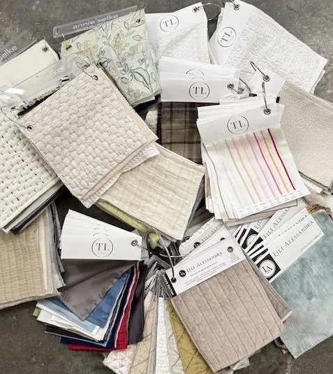 designer bedding samples including fabrics, quilts, and textile swatches