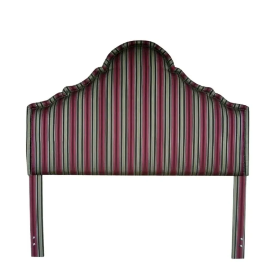 Headboard with striped fabric in red, green, black, and white.