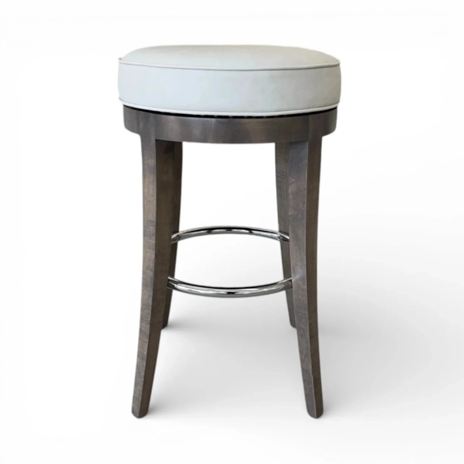 Wooden barstool with a round, white cushioned seat and metal ring footrest.