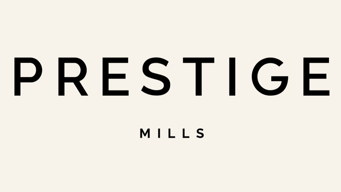 Black text 'PRESTIGE' with smaller text 'MILLS' underneath on a light background.