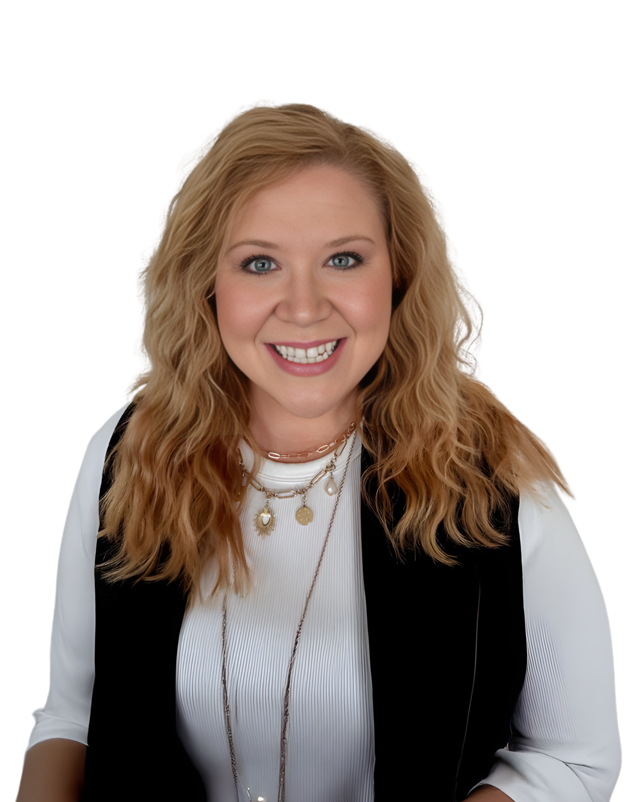 Portrait of a smiling woman with wavy blonde hair, wearing a white top with a black vest, and layered necklaces, against a white background.