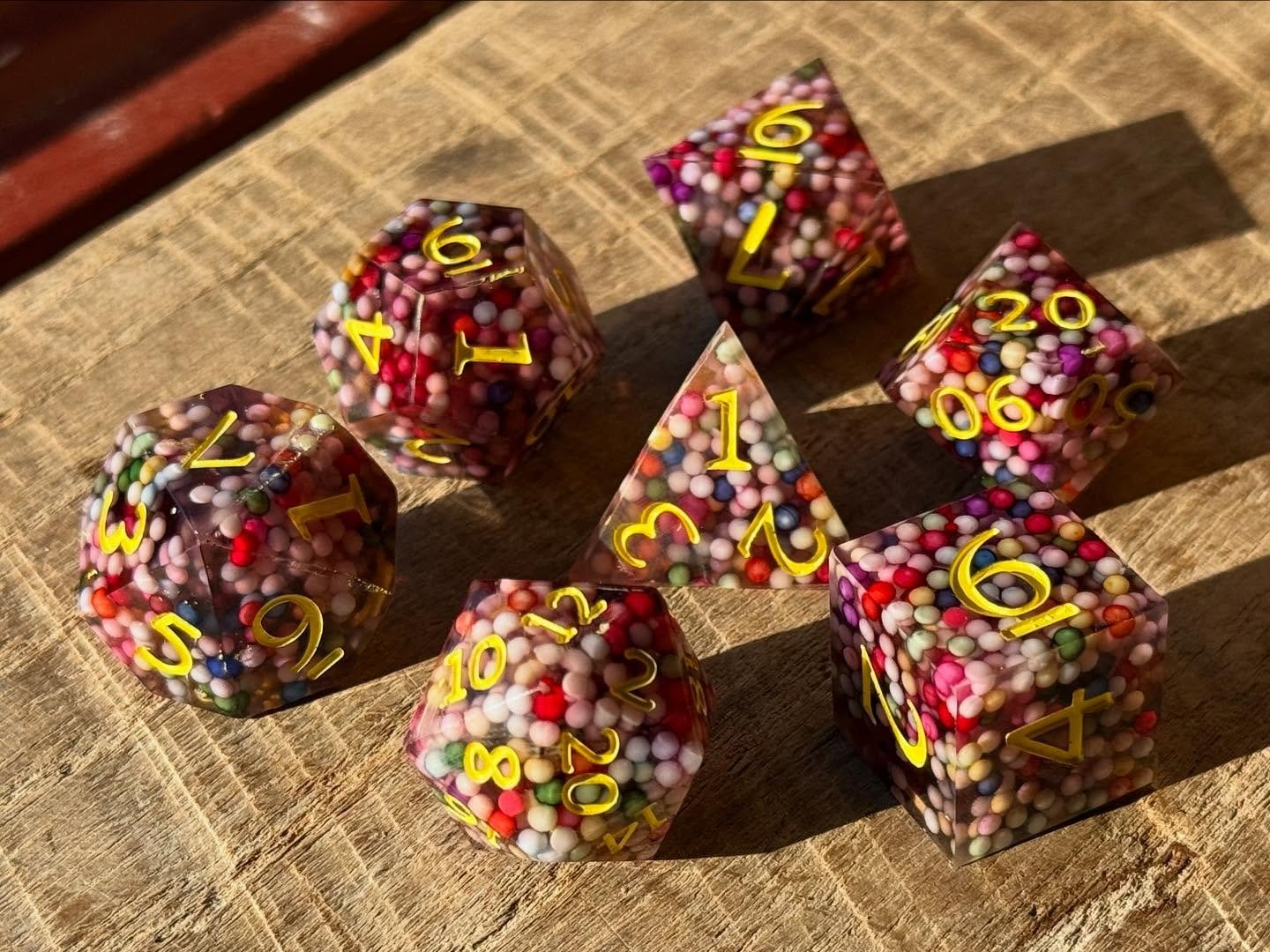 Just gotta sand up the edges up on these ball pit beauties and then they&rsquo;re all set for Tulsa Pride tomorrow from 10 AM - 10 PM! Come say howdy and snag a new batch of shiny rocks for your collection. 🎲🌈

#resindice #dicemaker #dnddice #ttrpg