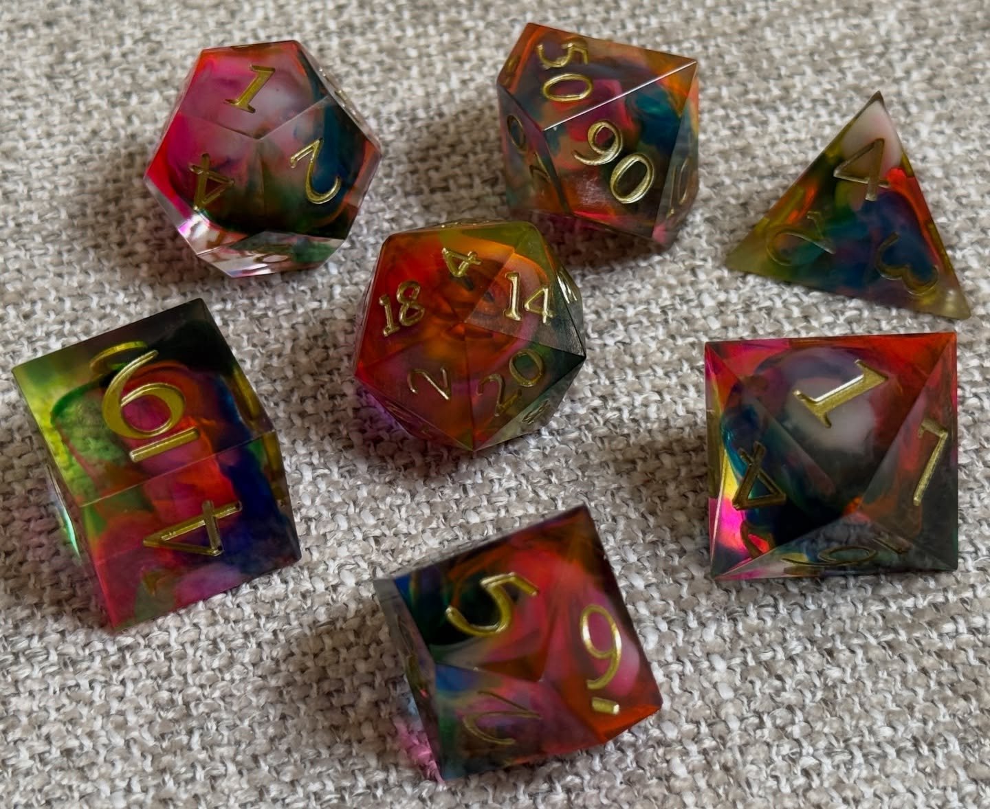 Hand-poured, pressure-cured and kissed by color. These dice are going to be haaaard to let go of. 😭🌈

#rainbowdice #resindice #handmadedice #customdice #dicemaking #dicemaker #diceart #dnddice #ttrpg #tabletopgaming #rpgdice #colorfuldice #fantasyd