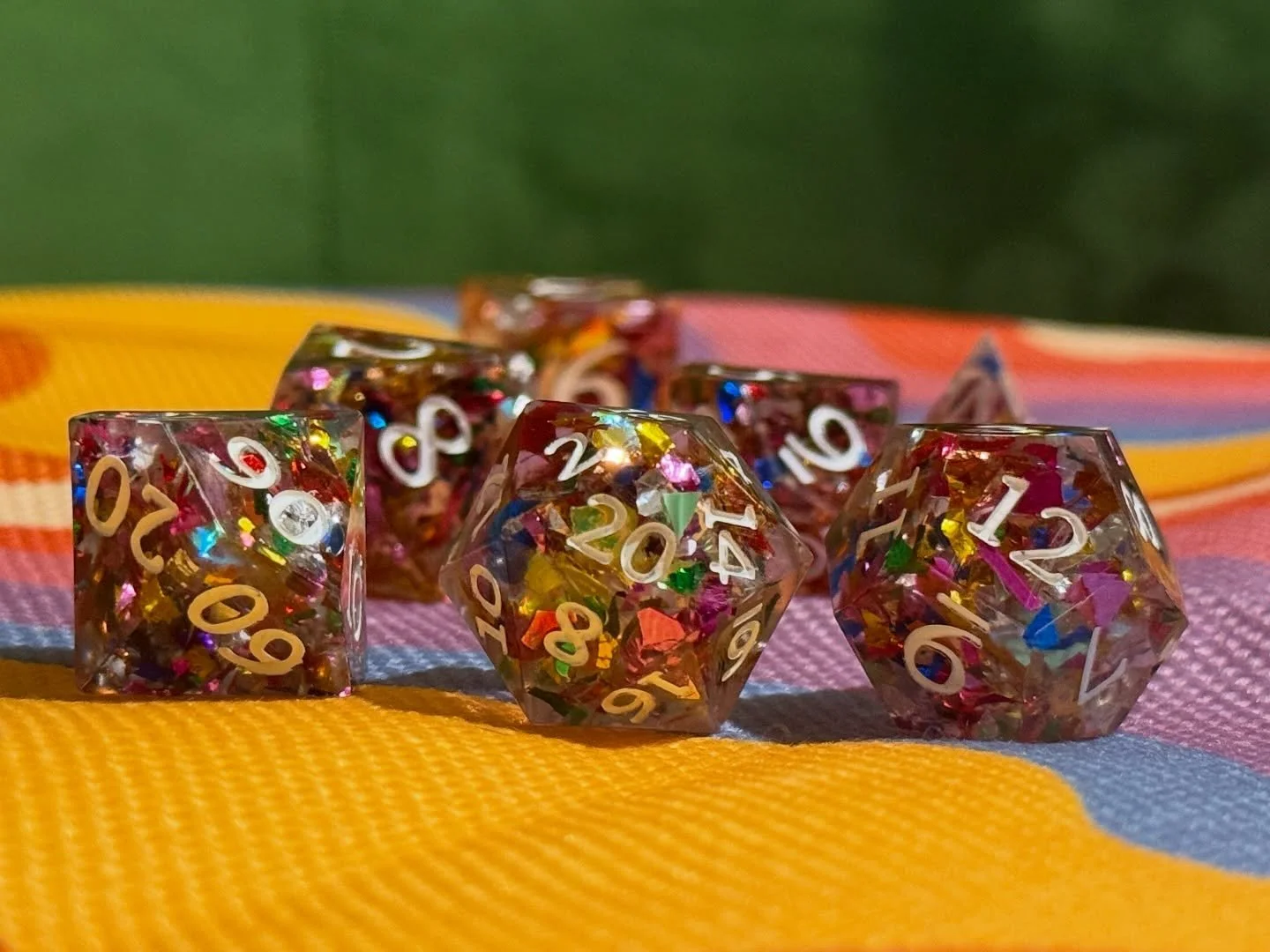 Surprise!!! 🎉 

This set is a little surprise party in your hand, full of color, confetti, and loads of fun. 🤩

#handmadedice #dicemaker #resindice #ttrpgdice #customdice