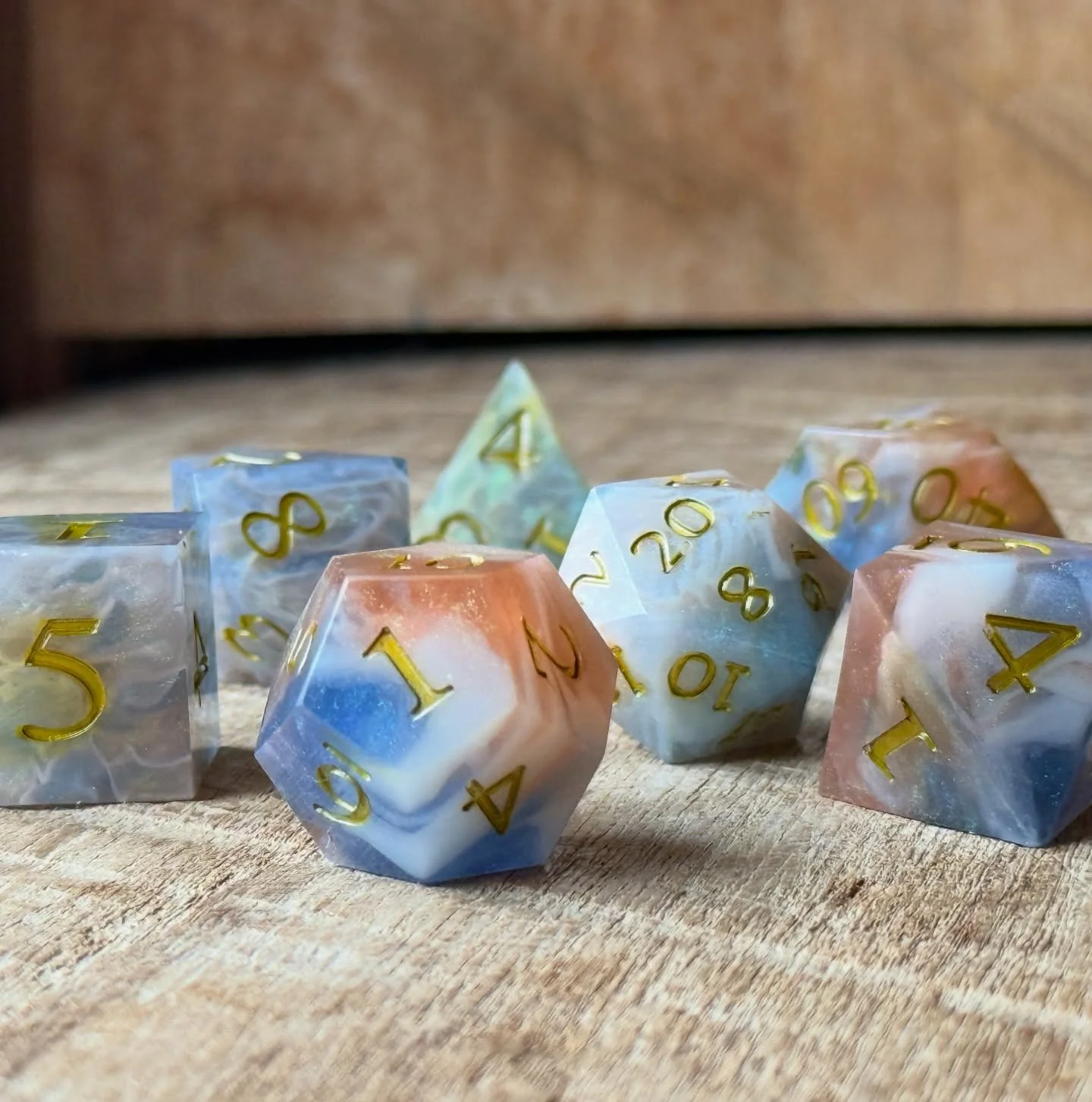 Equal parts warm and icy~
🩵🤍🧡

Speaking of ice, everyone stay warm and cozy in this snowy weather headed our way tonight! I&rsquo;m about to bunker down, eat a bunch of soup, make a snowman and sand/paint a metric ton of dice. ❄️

#resindice #dndd