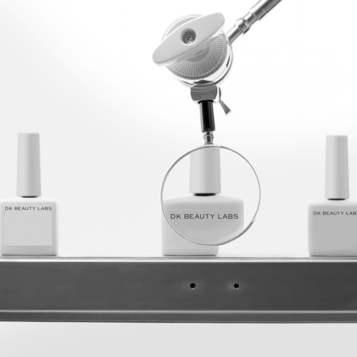 Three bottles of DK Beauty Labs products on a shelf with a magnifying glass highlighting the middle bottle, which is being examined by a robotic arm.