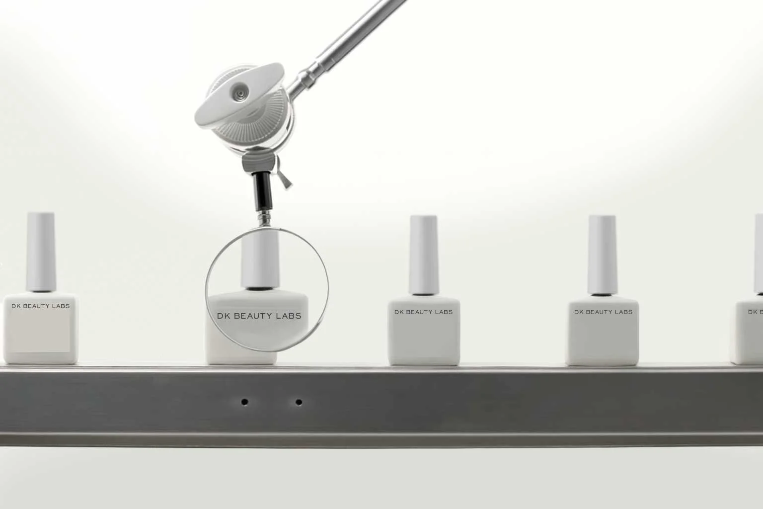 A row of white nail polish bottles labeled 'DK BEAUTY LABS' on a shelf, with one bottle being examined with a magnifying glass and a nail polish remover applicator above it.