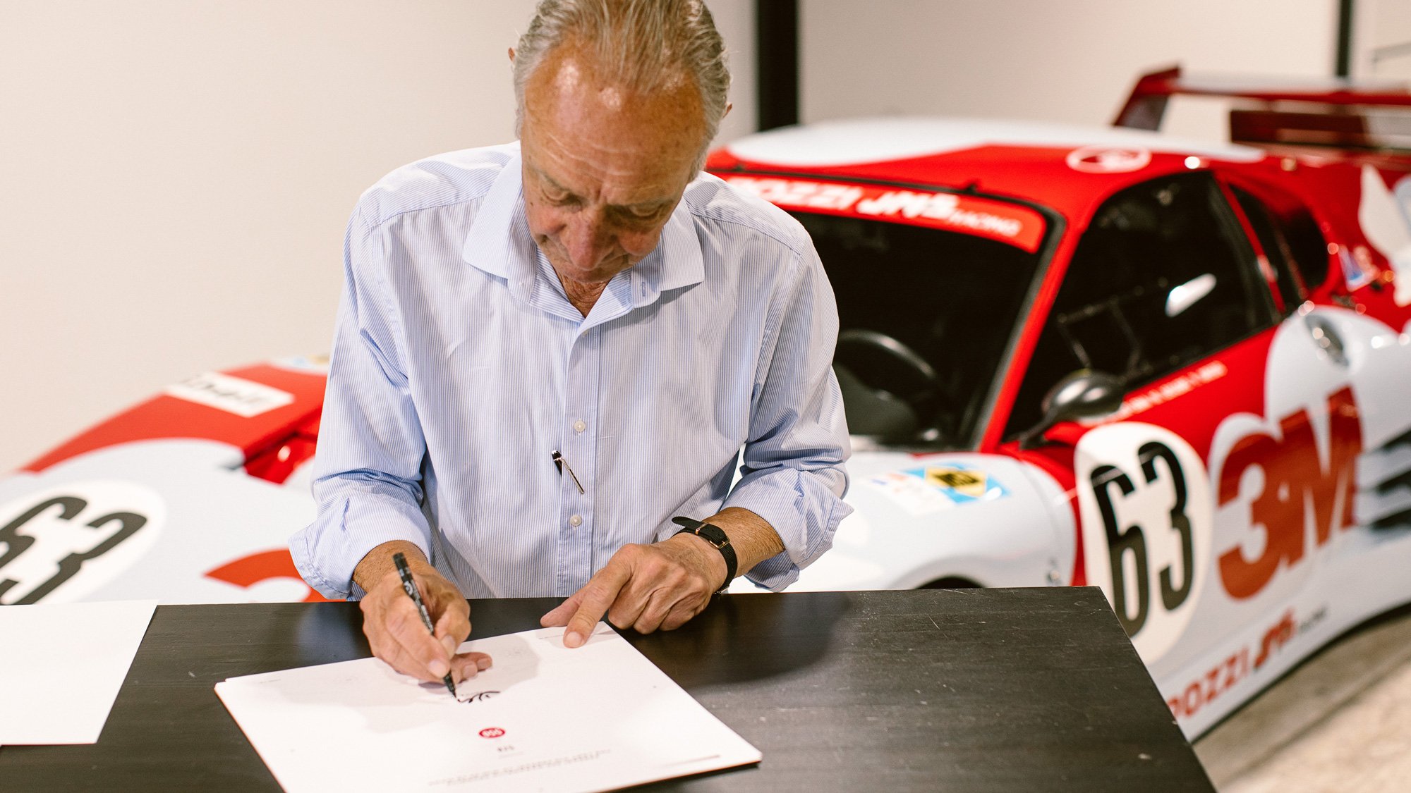 Keith Bluemel signing copies of the 550 Prodrive Book. Bespoke book designed by Motion Ltd