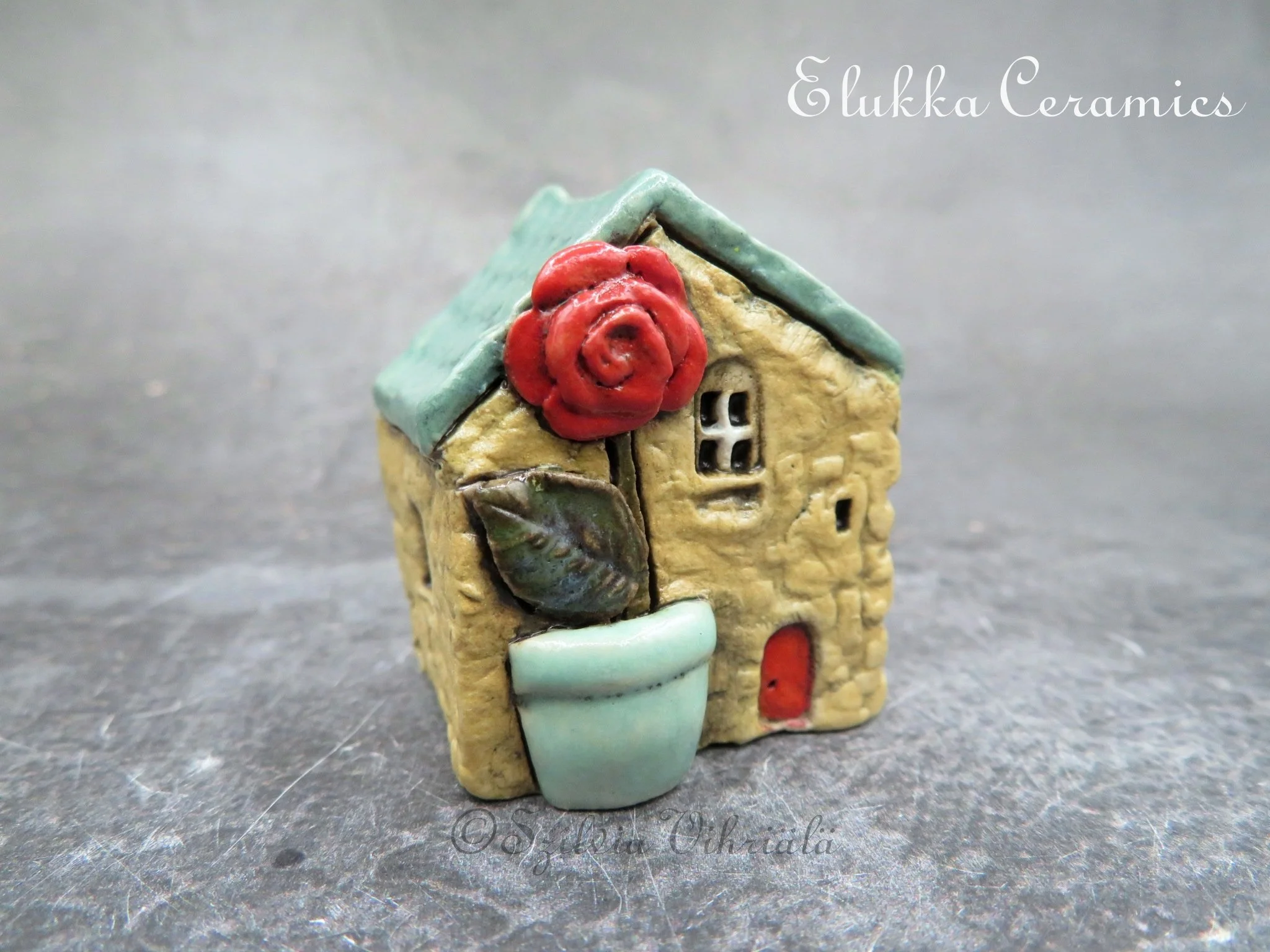 Collectible TINY Mediterranean Town House by elukka...Light Tan Walls & Turquoise Green Roof with Rose in Pot