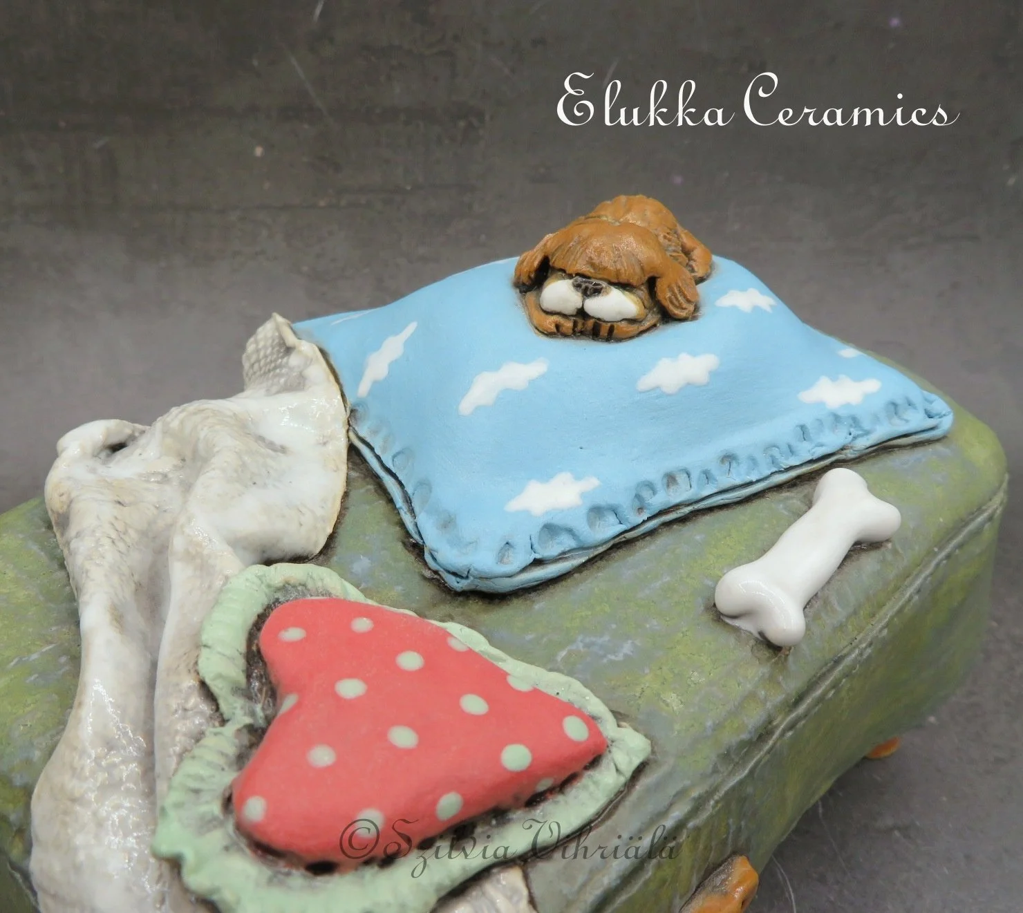 Sleeping Dog on Ottoman...Ceramic Dog Sculpture