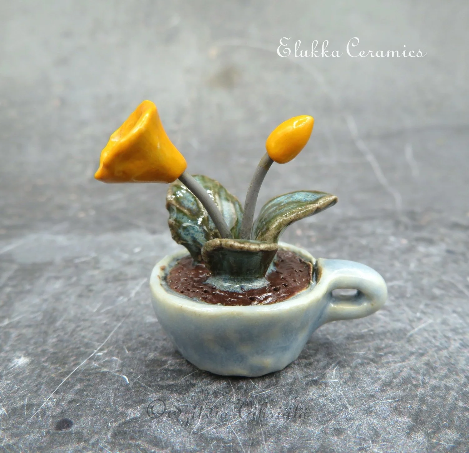 Collectible TINY Ceramic Bloom by elukka...Orange Flowers in Baby Blue Cup
