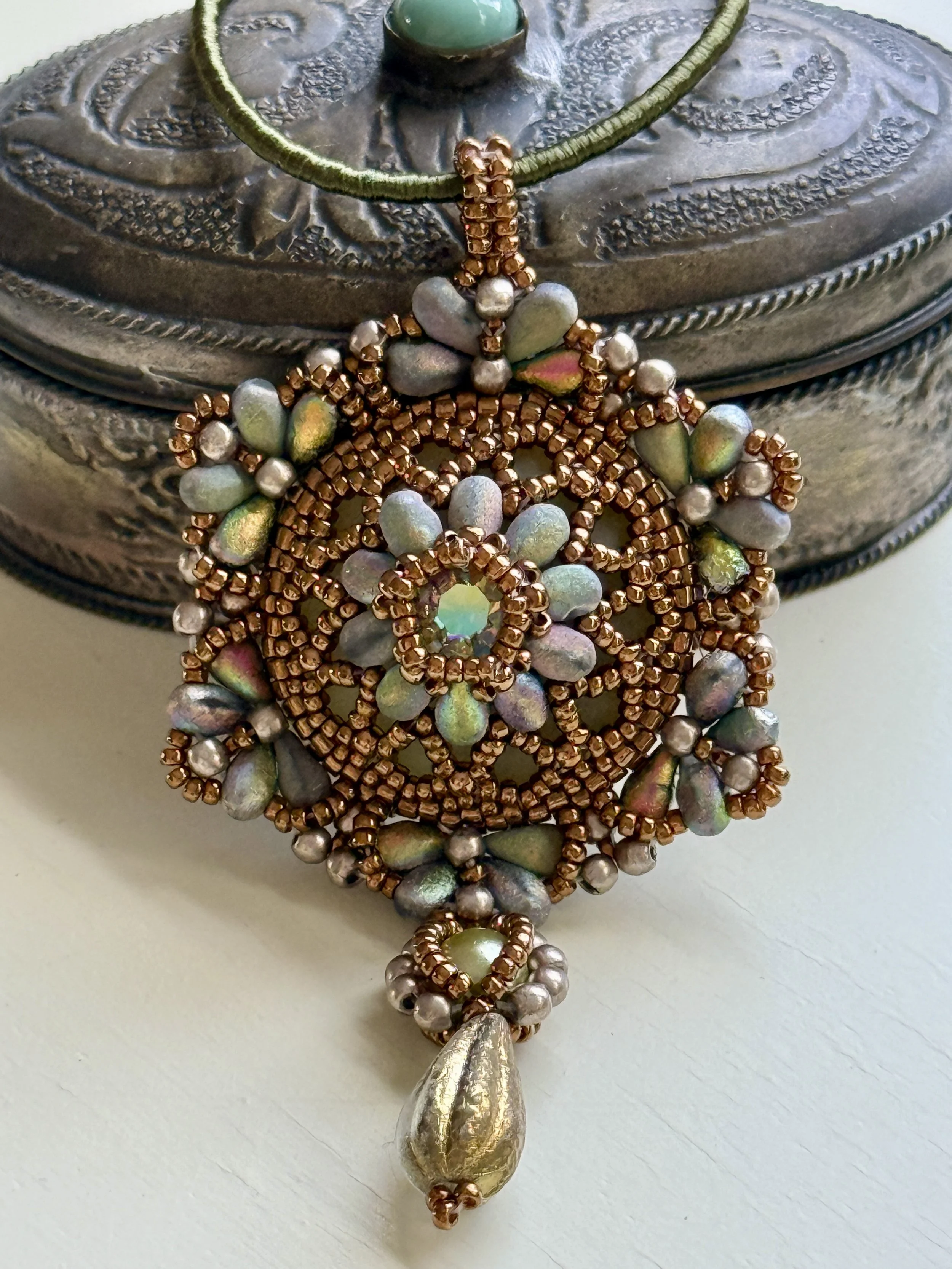Intricate beaded pendant