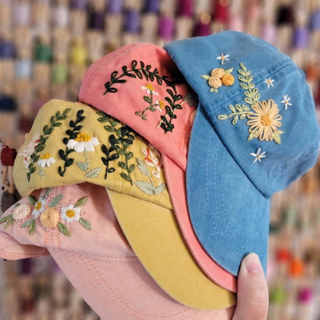4 hats embroidered with flowers