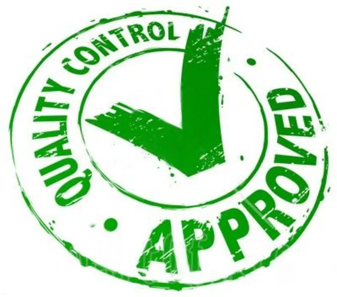 A person's hand is pouring white powder in the air against a plain white background.