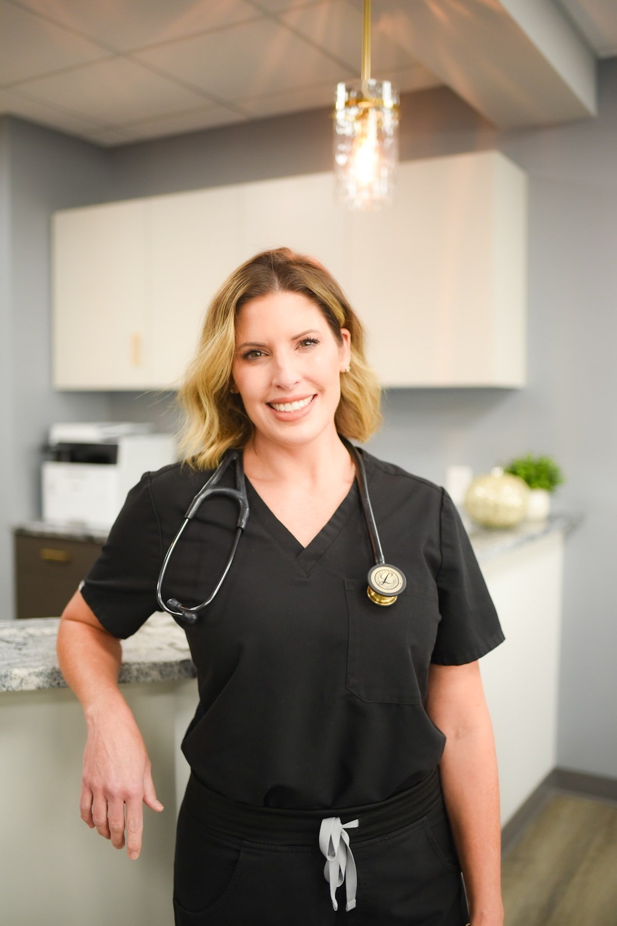 Dr. Kelli Peiffer standing in her office in Akron, OH.