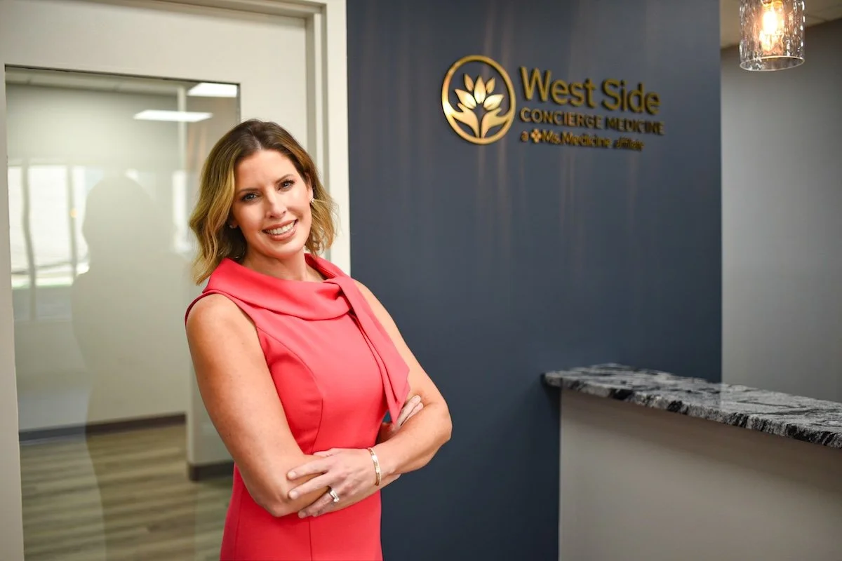 Dr. Kelli Peiffer standing in her reception area in Akron, OH.
