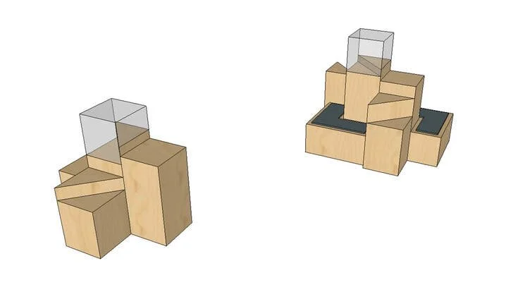 Two wooden seating units with black cushioned tops, each with a clear glass barrier and wooden side compartments.