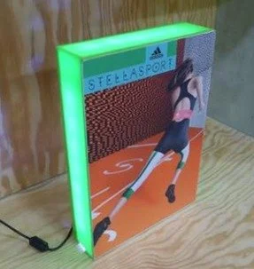 LED nightlight with a graphic of a female athlete running on a track, labeled 'Steelasport'.