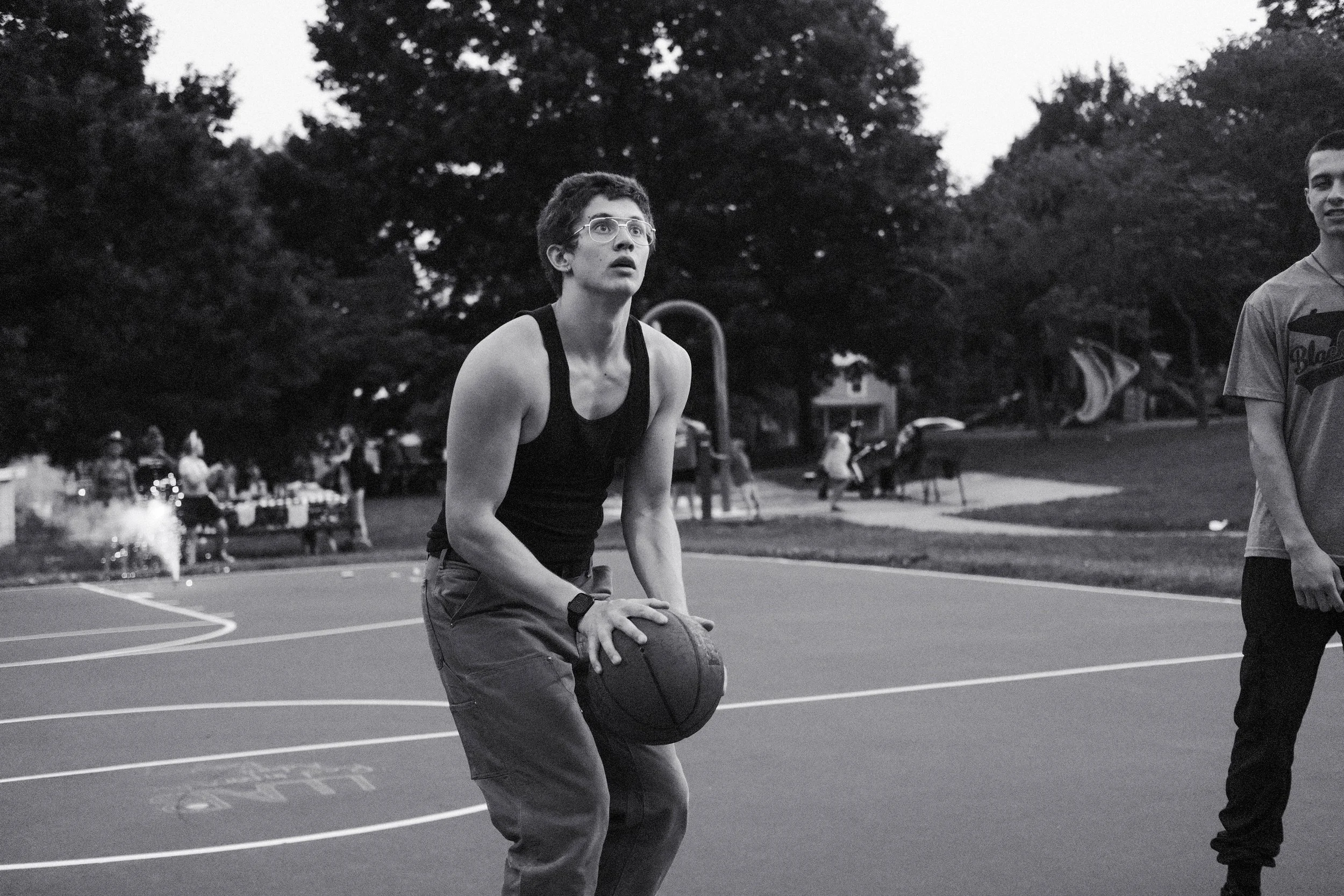 A friend lines up a shot.