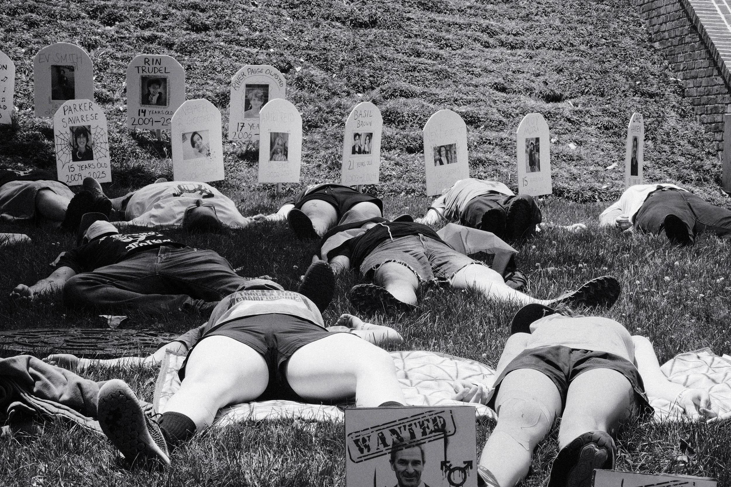 Multiple protesters attended the protest and lying "dead" in front of headstones.