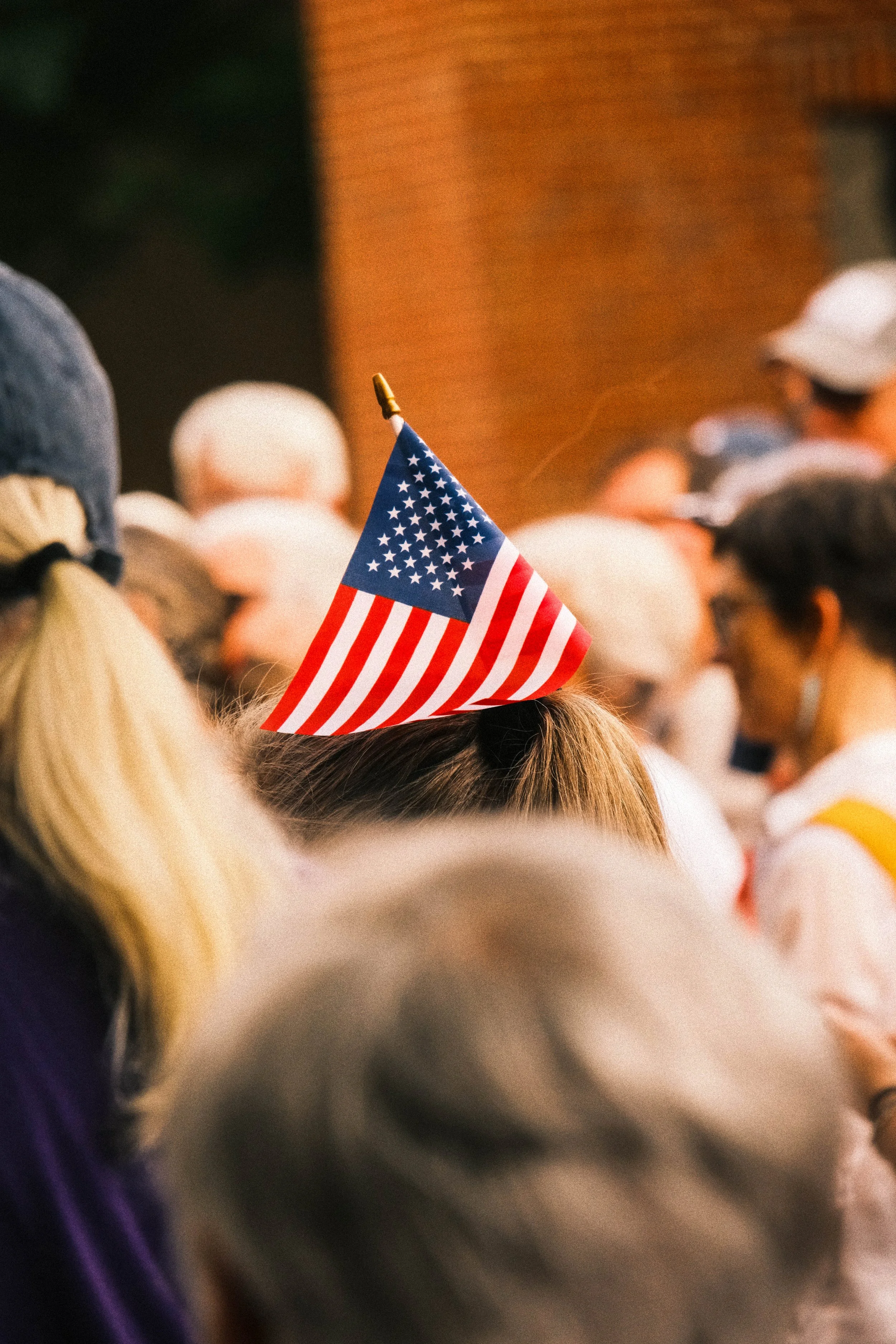 A protester brings an American flag to an anti-ICE protest.