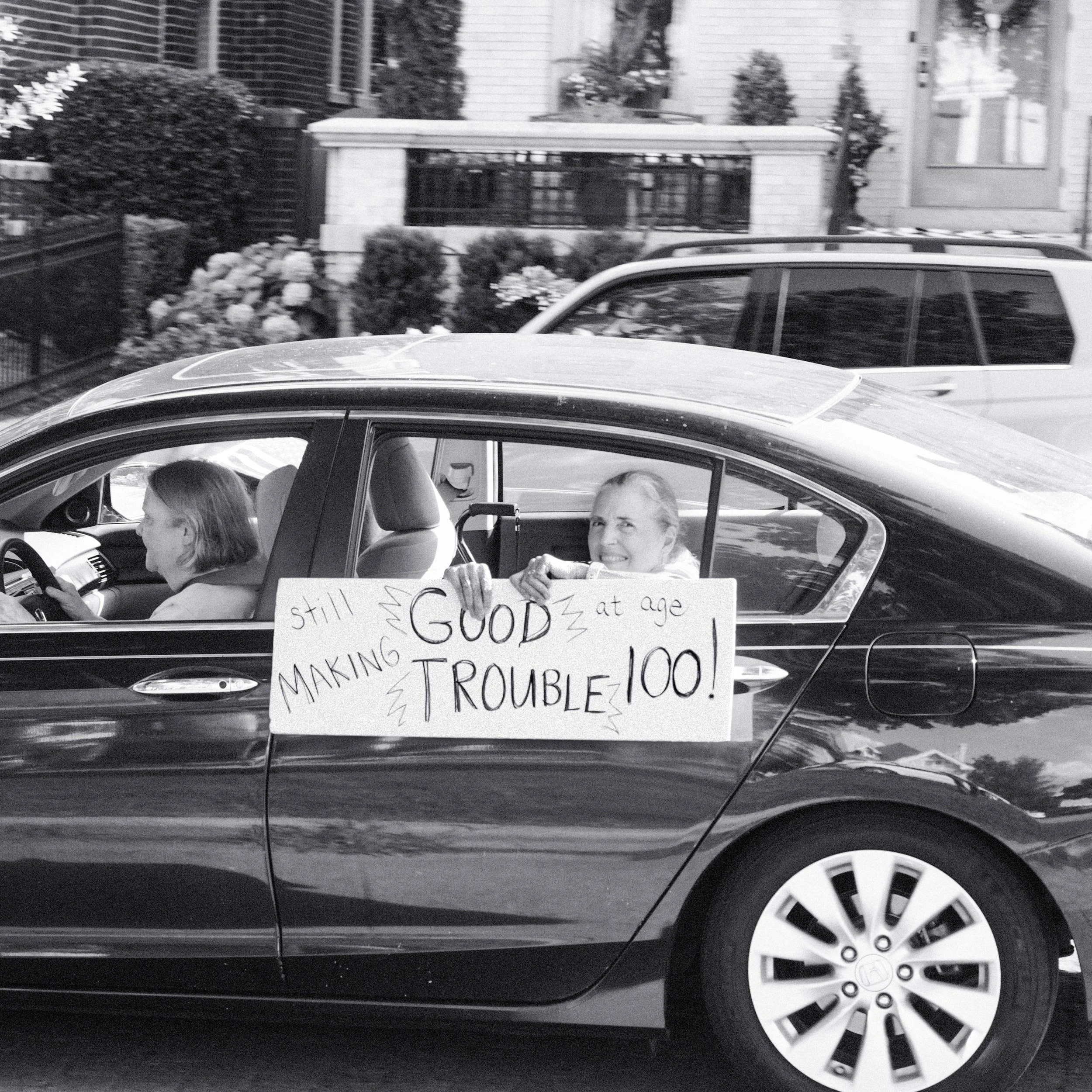A woman attending a protest at 100.