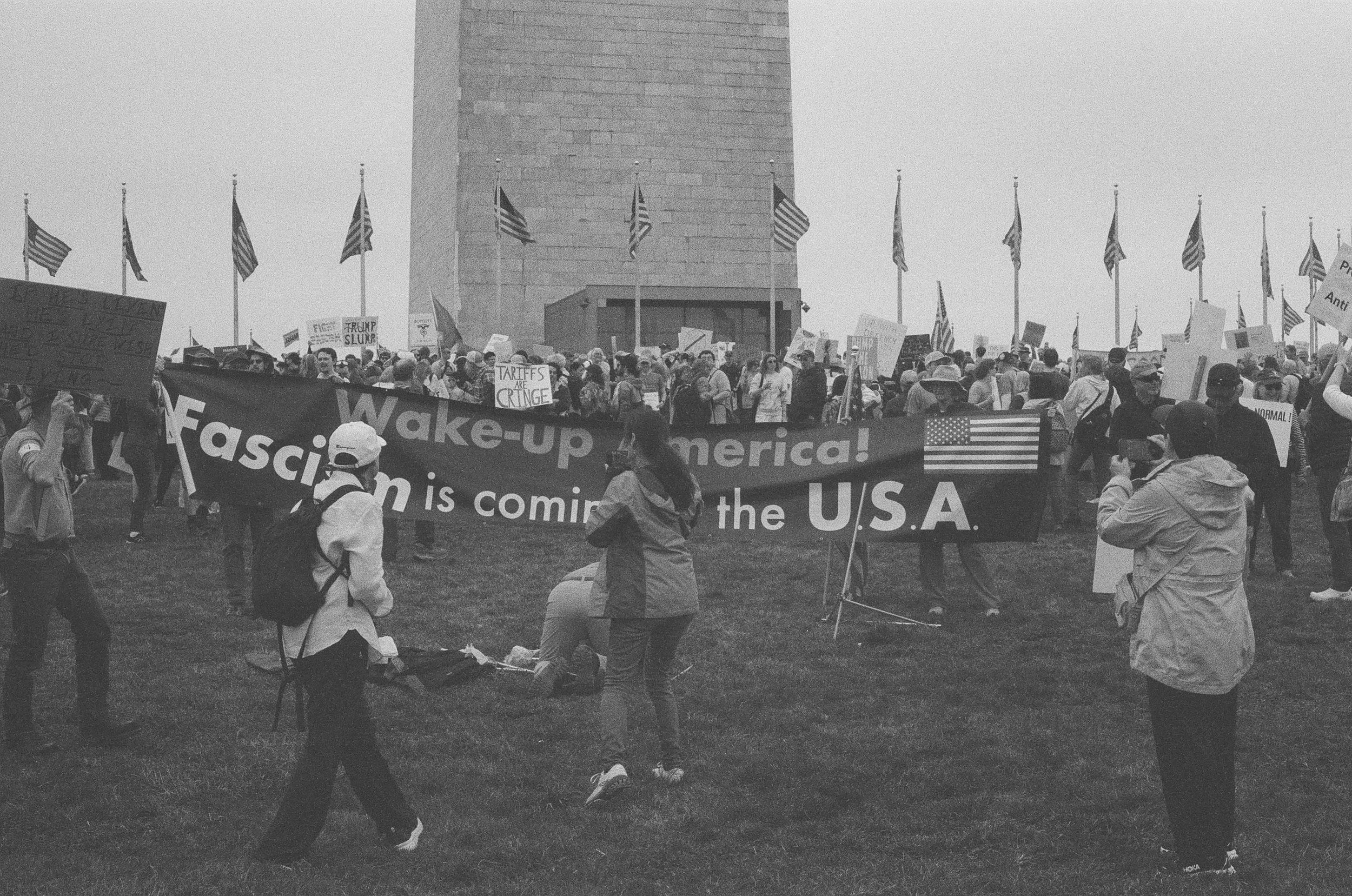 A long banner describing the incoming fascist threat in front of the Washington Monument.