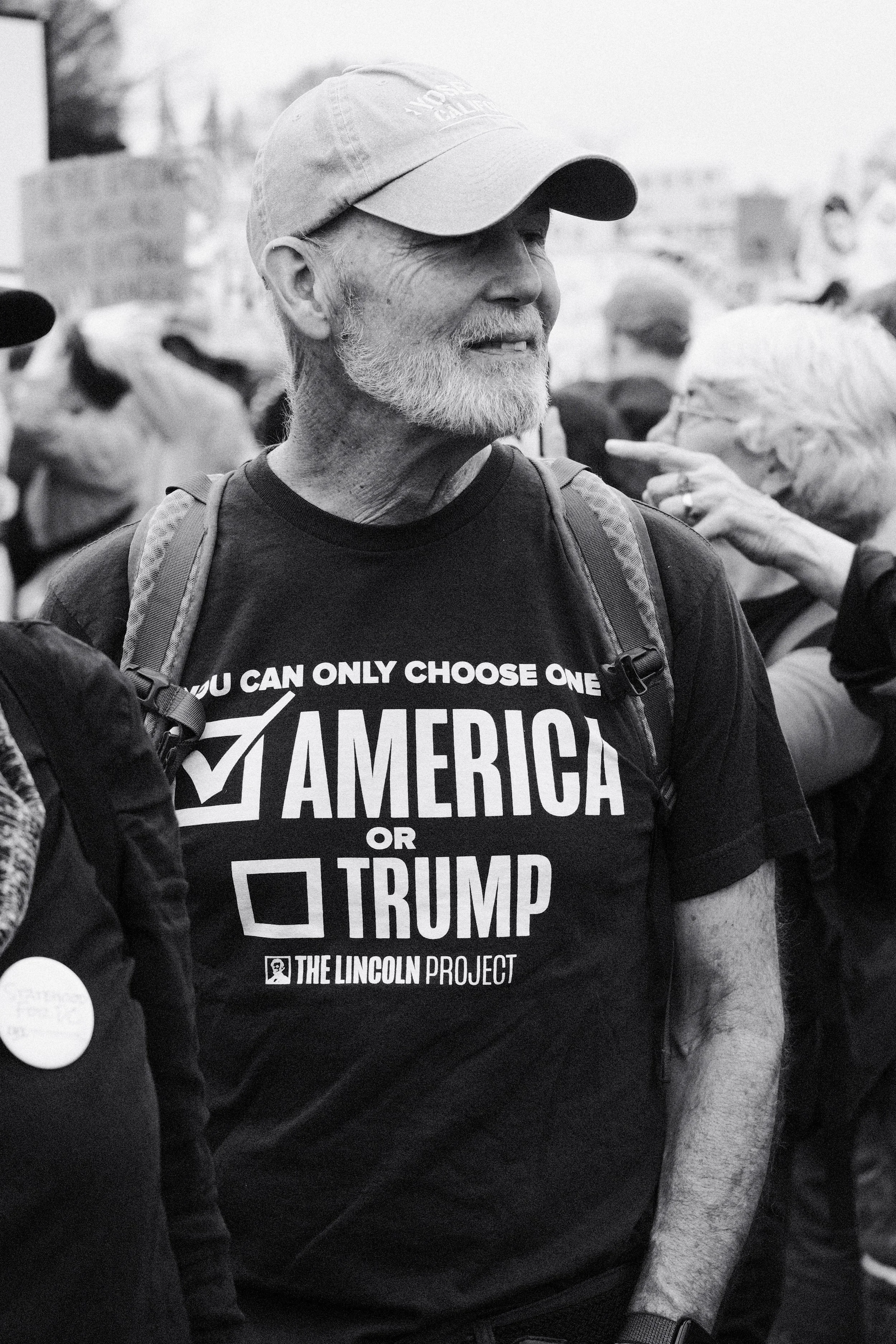 A man in a Lincoln Project shirt.