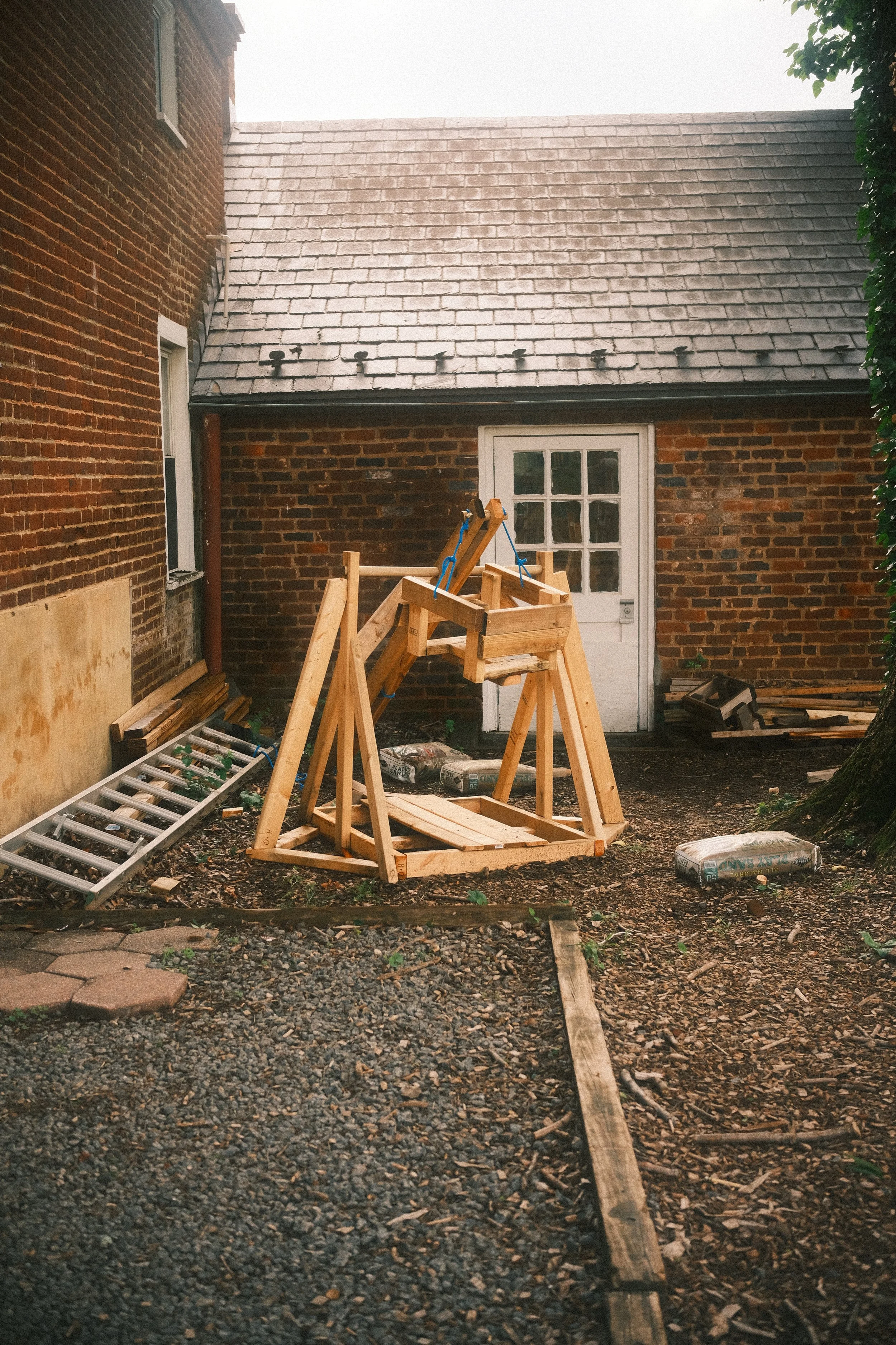 A trebuchet build by students sits unused.