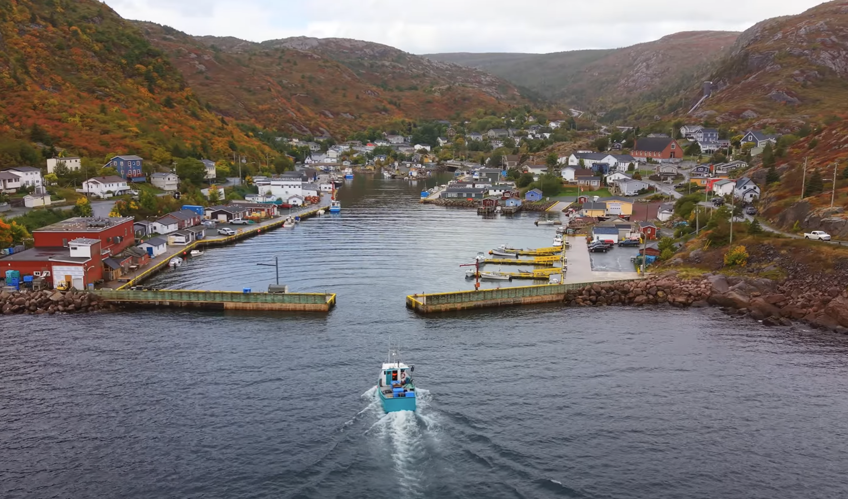A Boat Entering Petty Harbour in Fall