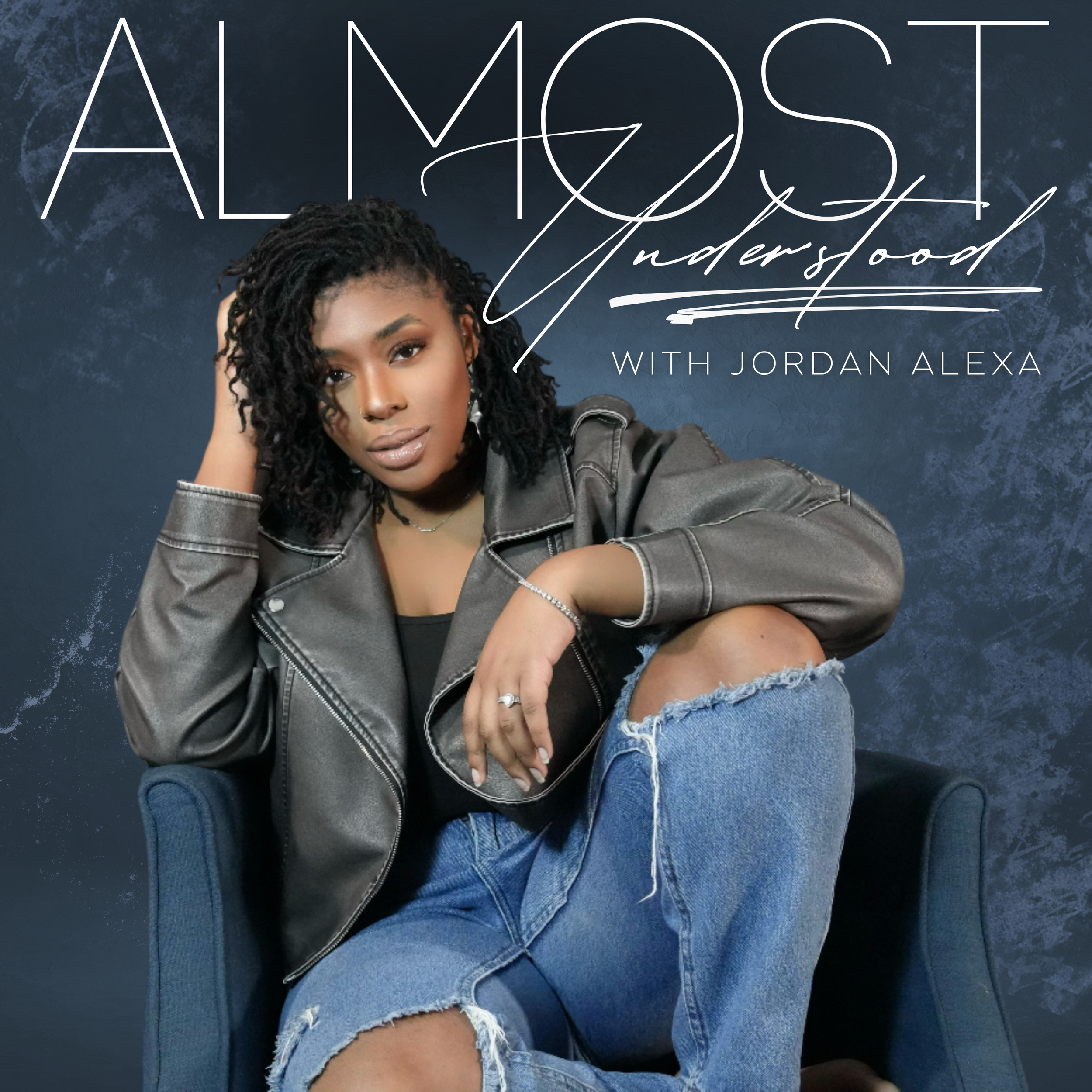 A woman with natural curly hair, wearing a gray leather jacket and ripped jeans, sitting on a dark blue chair against a textured blue background. The text reads, 'ALMOST Understood with Jordan Alexa' with the woman appearing confident and relaxed.