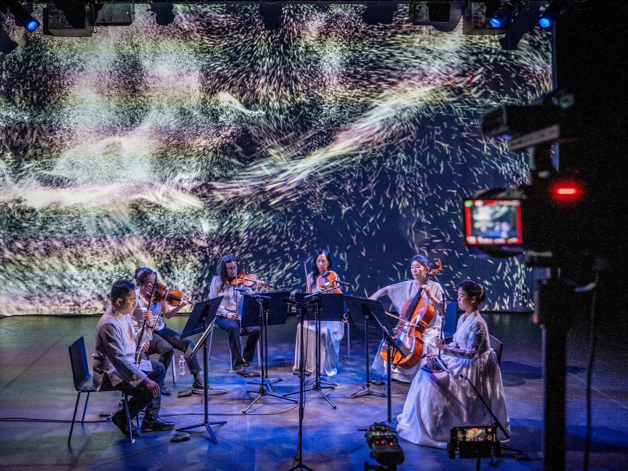 Photo of Calling of the Whales performance from Strings Attached Across the Pacific, composed and produced by Hee Yun Kim; Elevator Project at AT&T Performing Arts Center