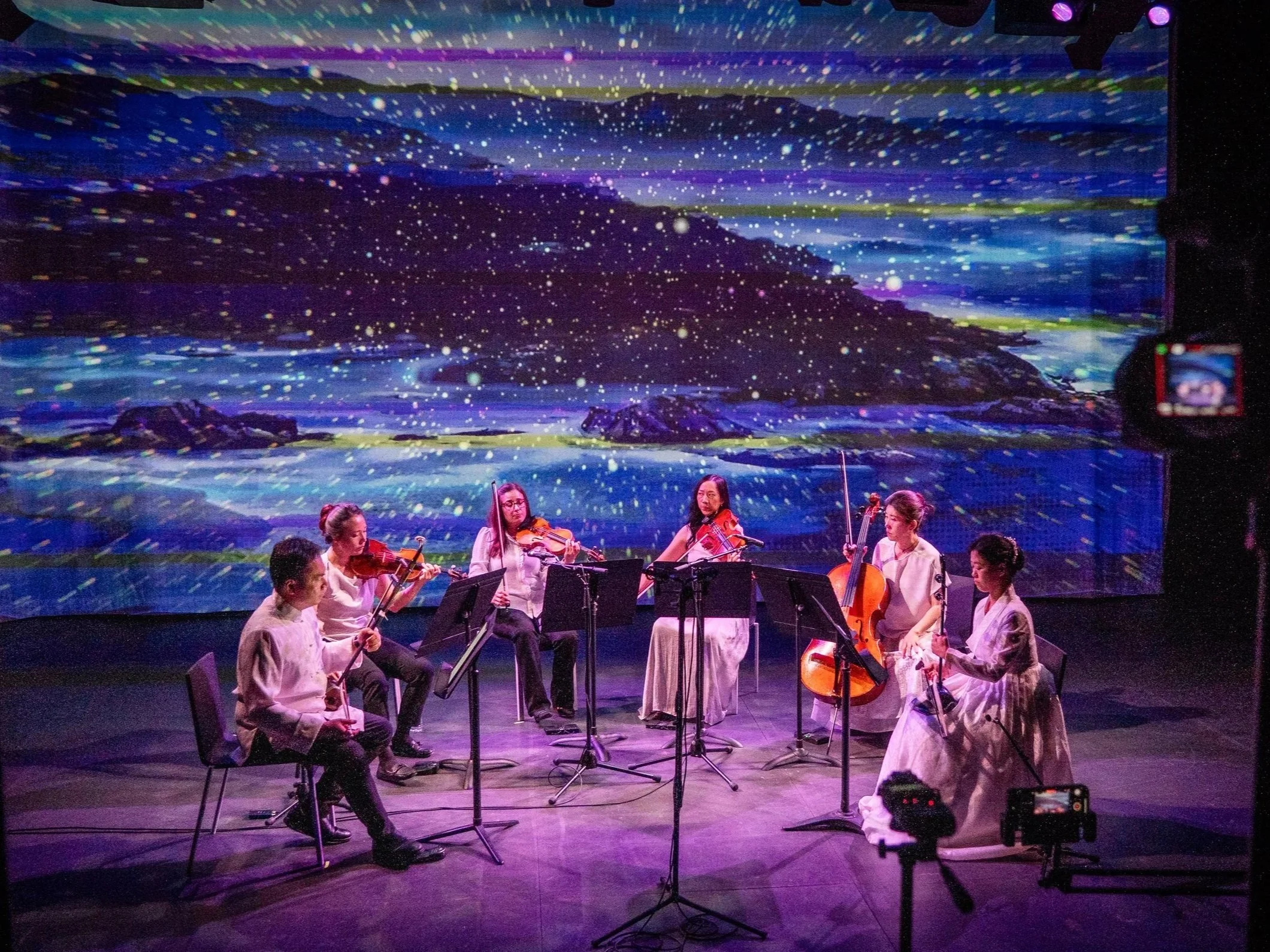 Photo of Calling of the Whales performance from Strings Attached Across the Pacific, composed and produced by Hee Yun Kim; Elevator Project at AT&T Performing Arts Center