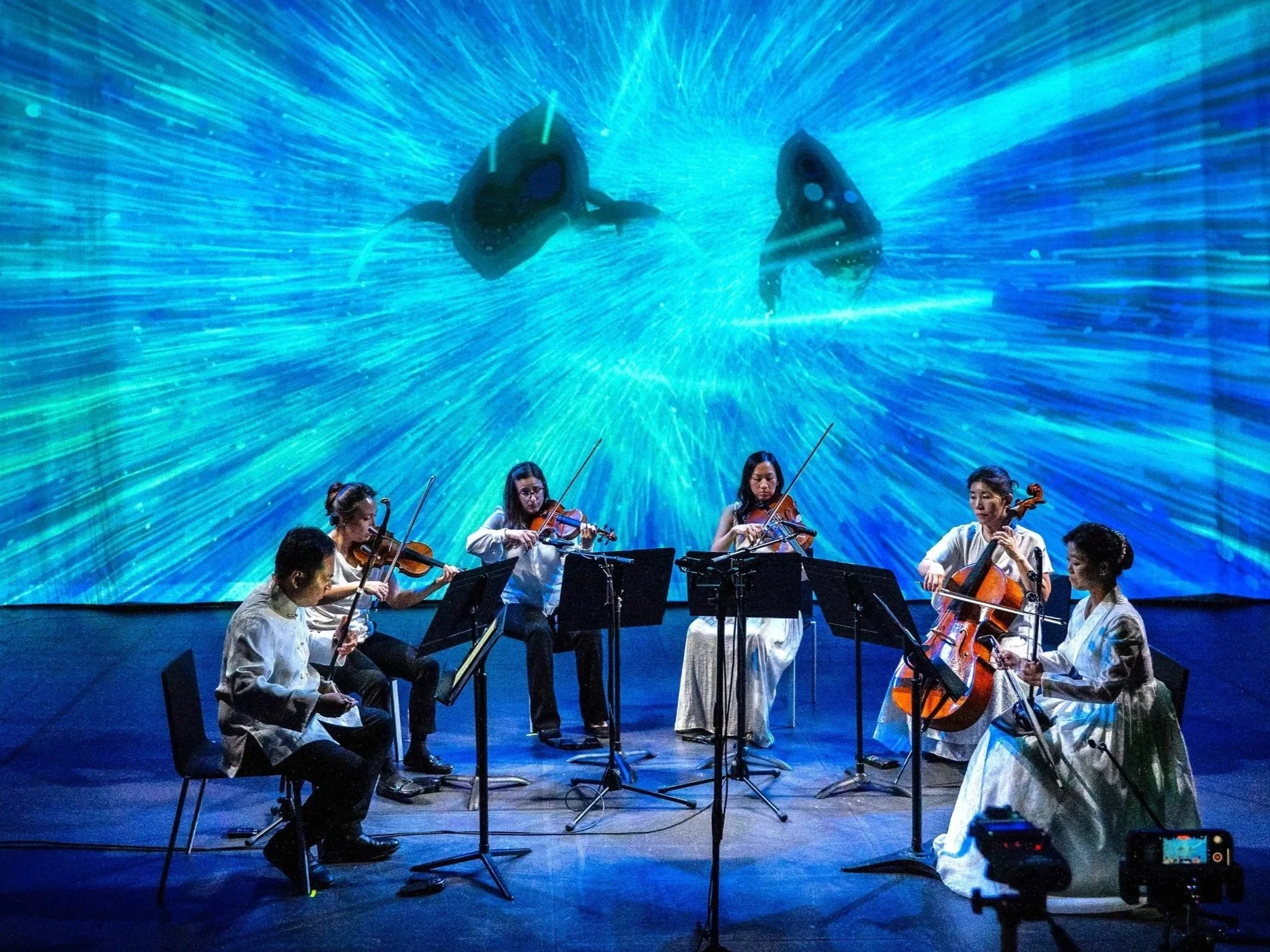 Photo of Calling of the Whales performance from Strings Attached Across the Pacific, composed and produced by Hee Yun Kim; Elevator Project at AT&T Performing Arts Center
