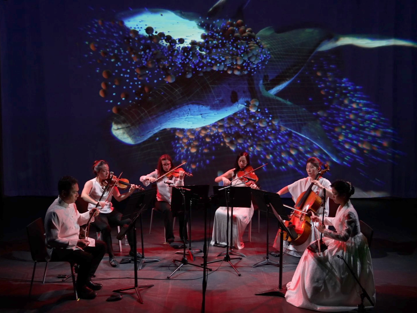 Photo of Calling of the Whales performance from Strings Attached Across the Pacific, composed and produced by Hee Yun Kim; Elevator Project at AT&T Performing Arts Center