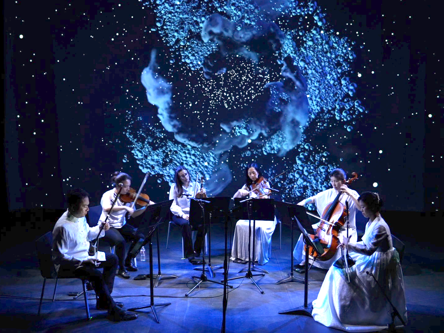 Photo of Calling of the Whales performance from Strings Attached Across the Pacific, composed and produced by Hee Yun Kim; Elevator Project at AT&T Performing Arts Center