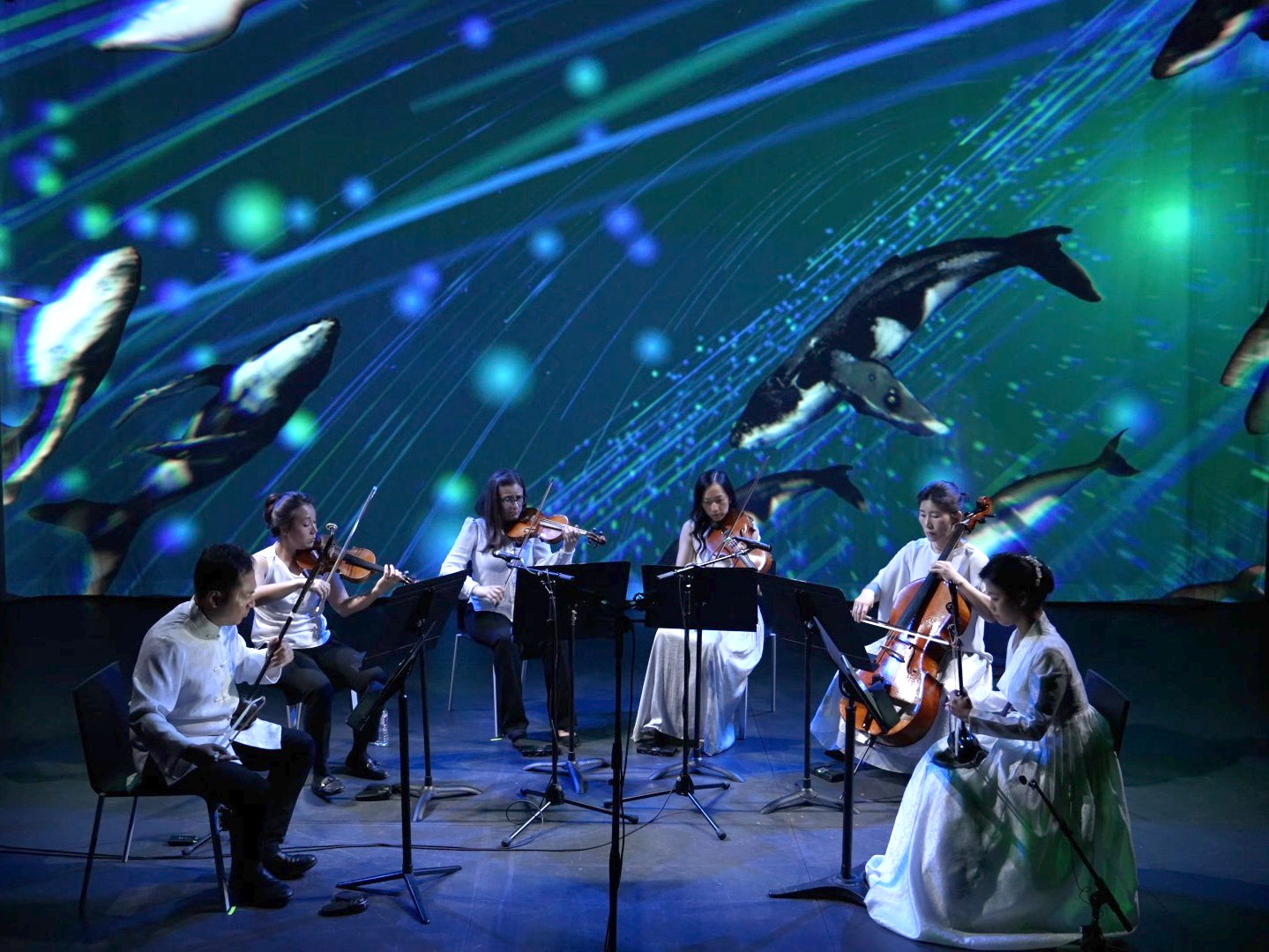 Photo of Calling of the Whales performance from Strings Attached Across the Pacific, composed and produced by Hee Yun Kim; Elevator Project at AT&T Performing Arts Center