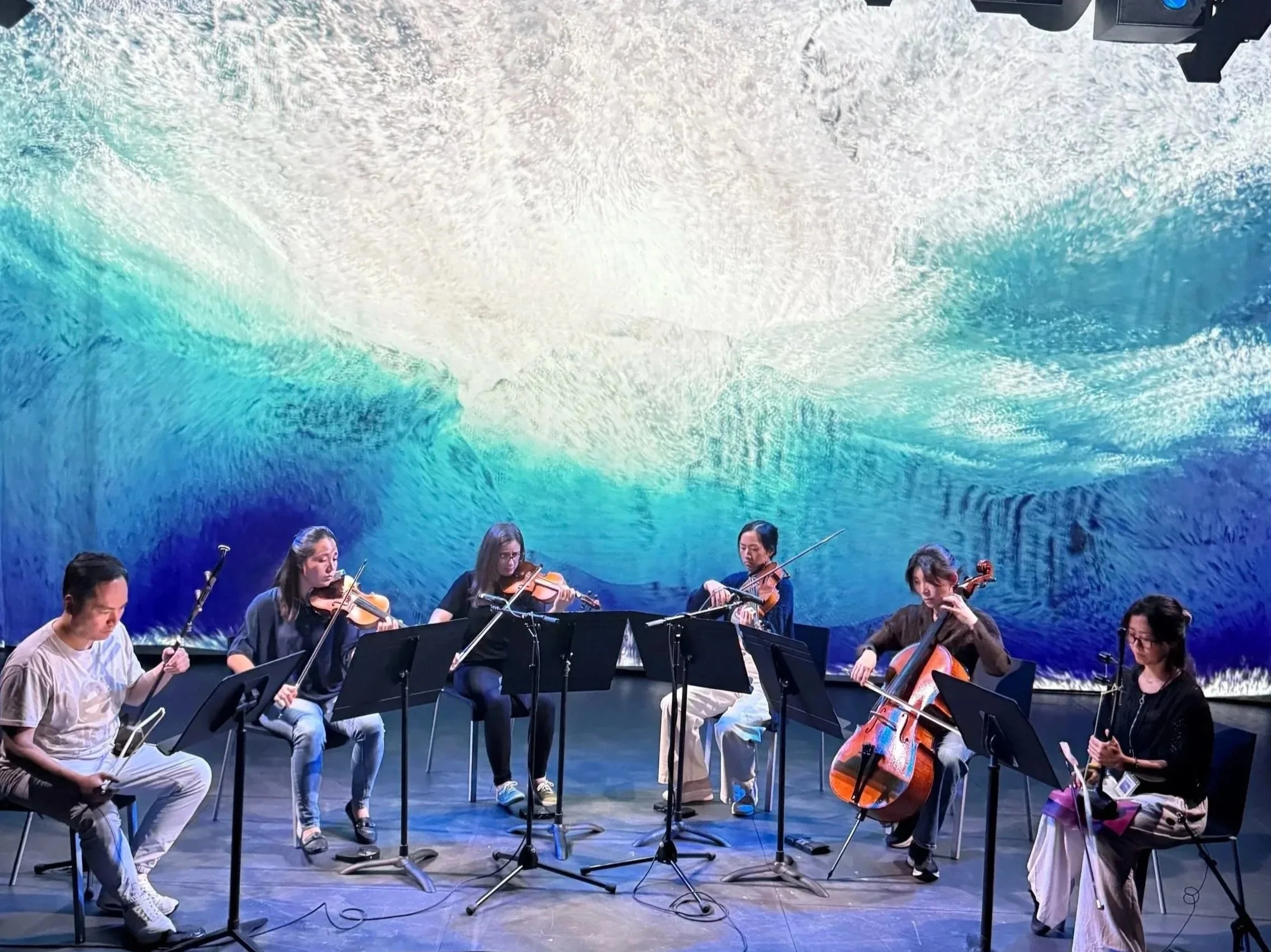 Photo of Calling of the Whales performance from Strings Attached Across the Pacific, composed and produced by Hee Yun Kim; Elevator Project at AT&T Performing Arts Center