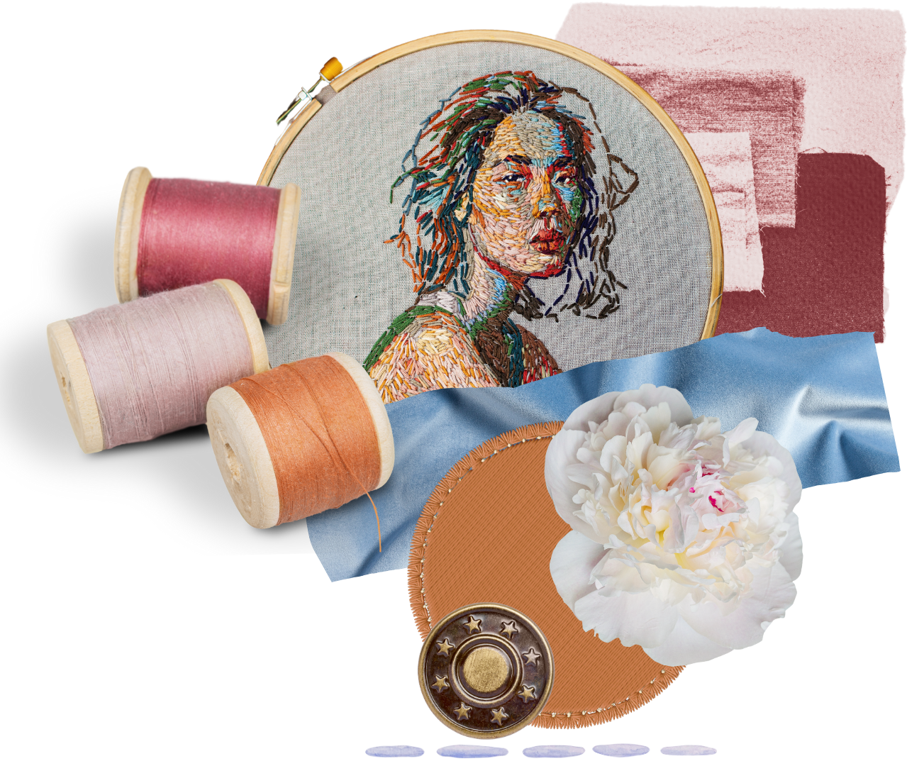 Embroidery hoop with a portrait of a woman, surrounded by spools of pink, light pink, and orange thread, a blue satin fabric with a white flower, a round orange fabric piece, a brass button, and torn pieces of fabric in pink and maroon.