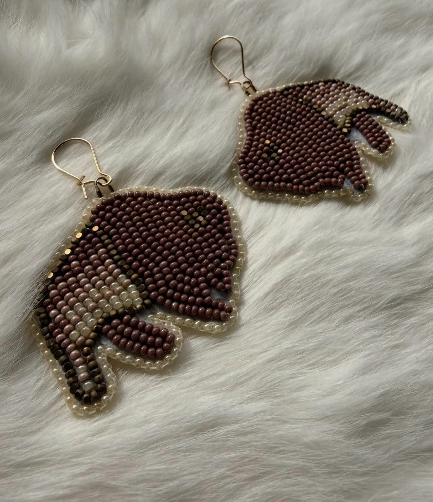 Some buffalo earrings I made, absolutely love how these turned out! 🦬 

#metis #metisbeadwork #indigenous #indigenousbeadwork #beadedearrings