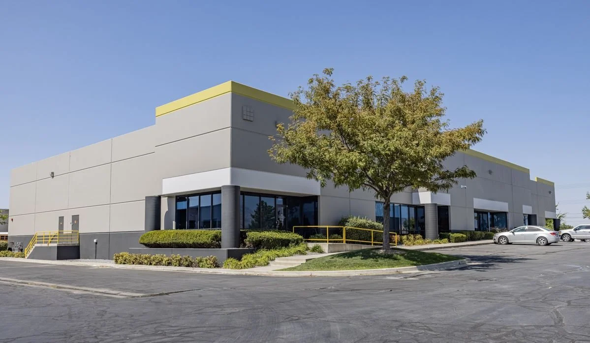 Commercial painting Seattle – industrial warehouse with metal siding and loading bays