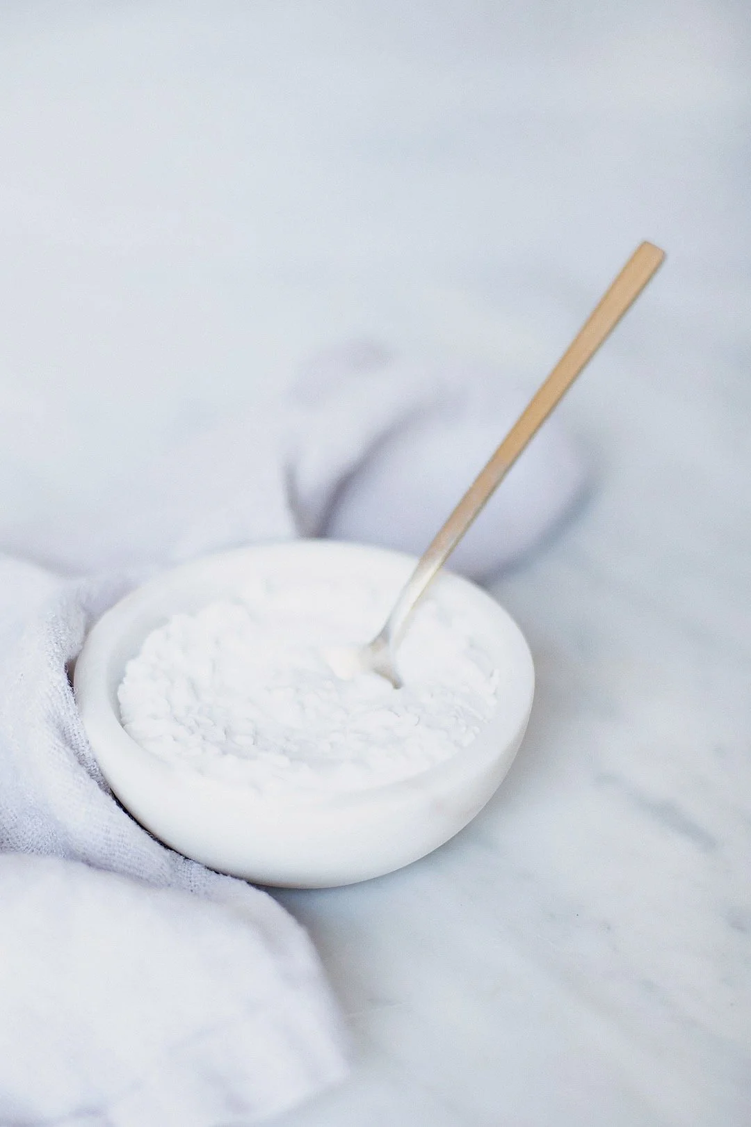 Step-by-step baking soda test setup with baking soda in a bowl.