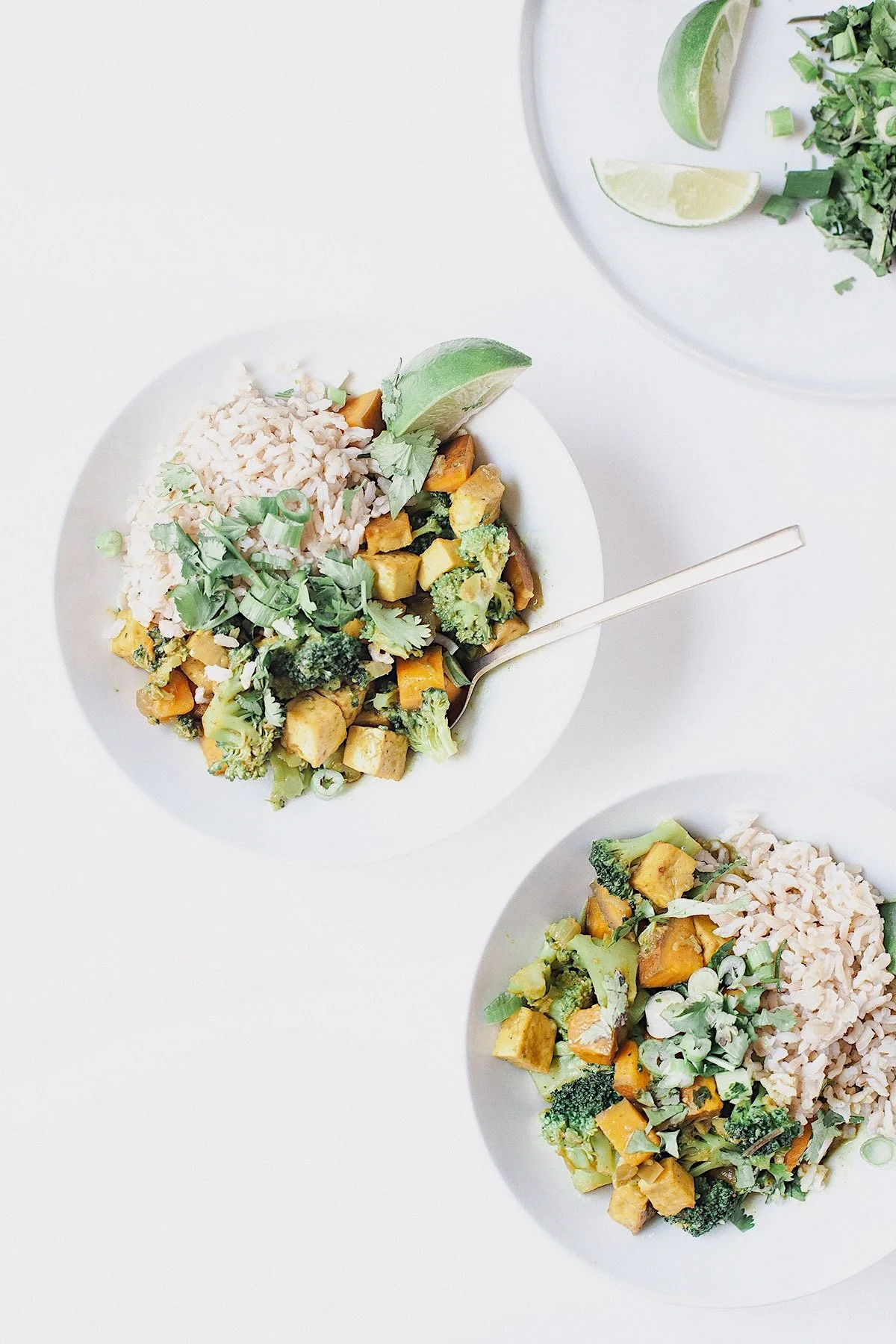 Easy anything curry with broccoli, sweet potato, tofu, brown rice, cilantro, and lime.