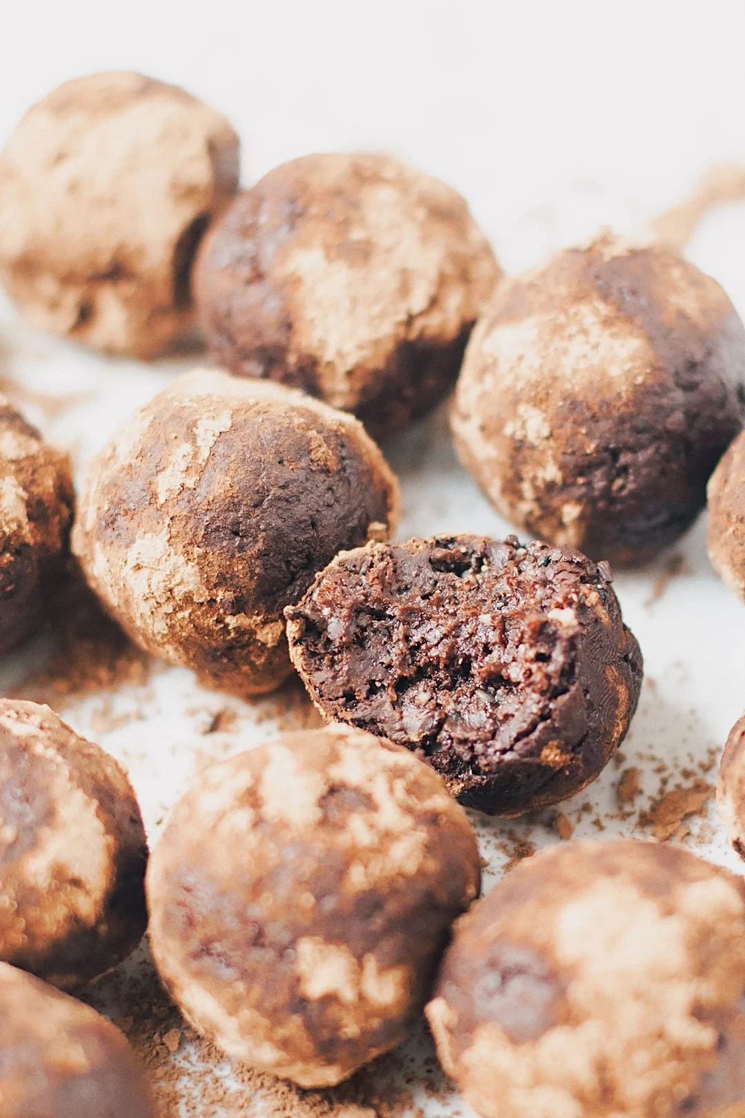 Close-up of vegan seed cycling brownie bites showing rich chocolate texture and cocoa coating.