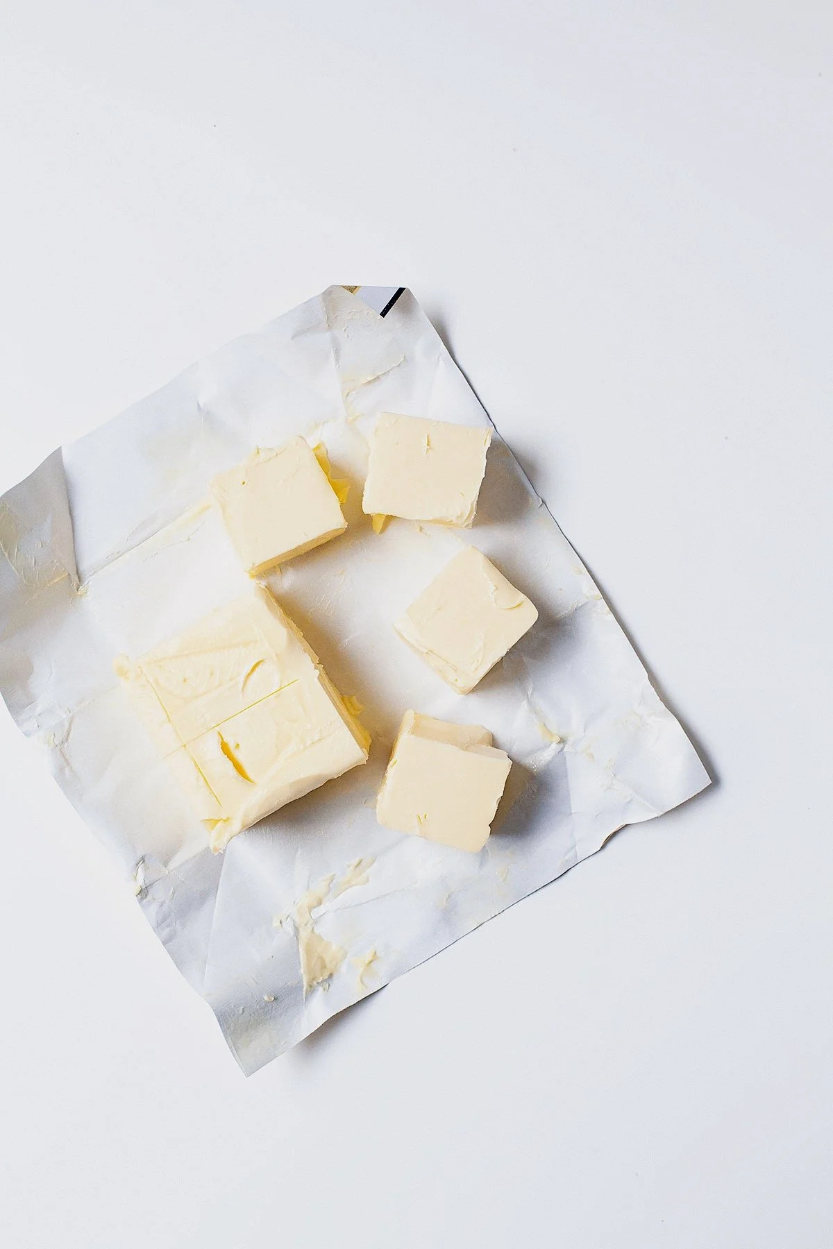 Cubes of grass-fed butter on parchment paper.