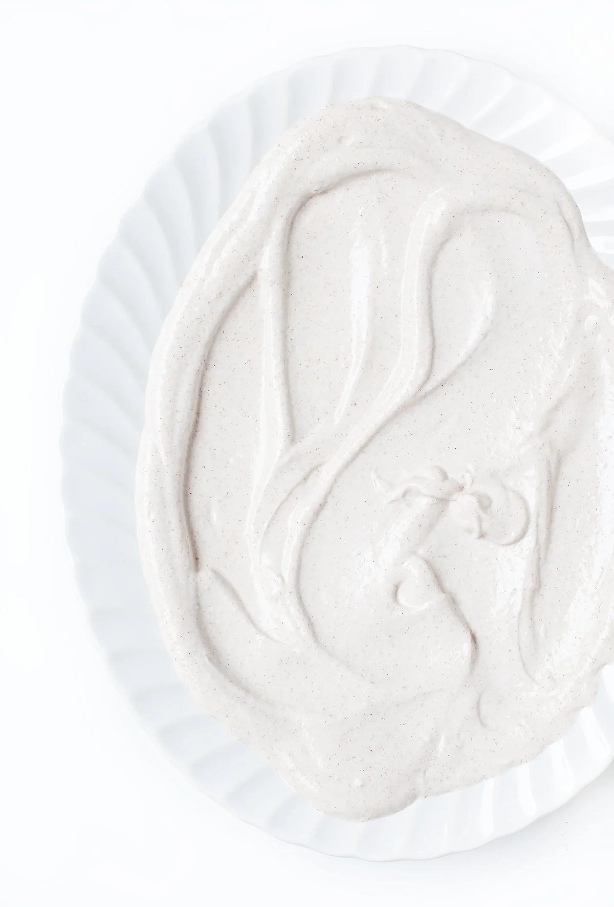 Spiced tahini yogurt sauce with lemon, cumin, and cinnamon.